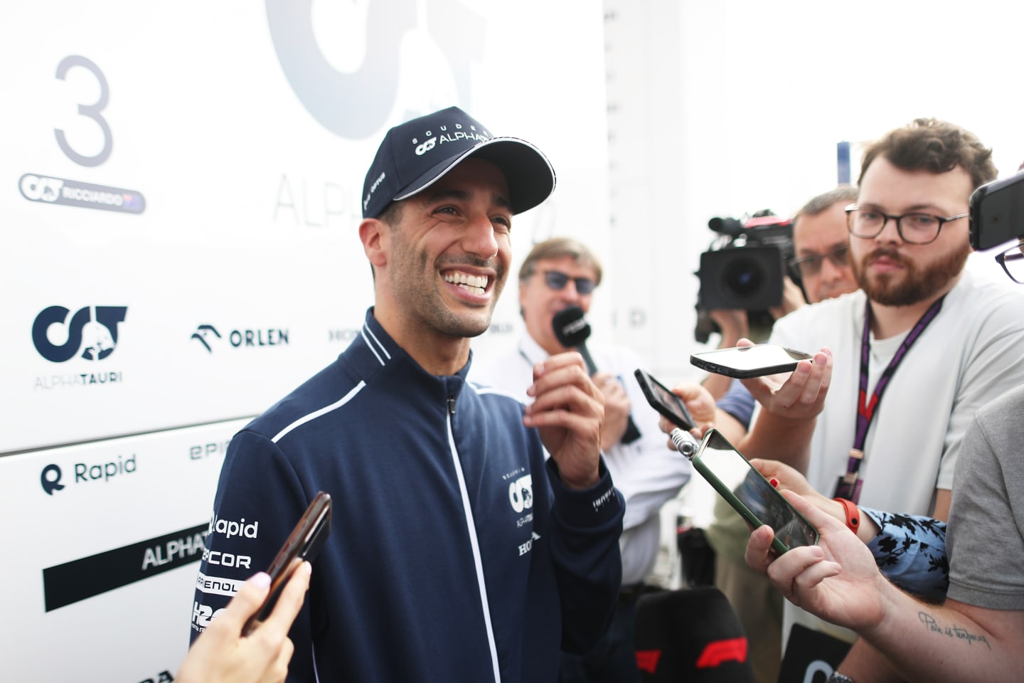 BUDAPEST, HUNGARY - JULY 21: Daniel Ricciardo of Australia and Scuderia AlphaTauri talks to the media in the Paddock after practice ahead of the F1 Grand Prix of Hungary at Hungaroring on July 21, 2023 in Budapest, Hungary. (Photo by Peter Fox/Getty Images)