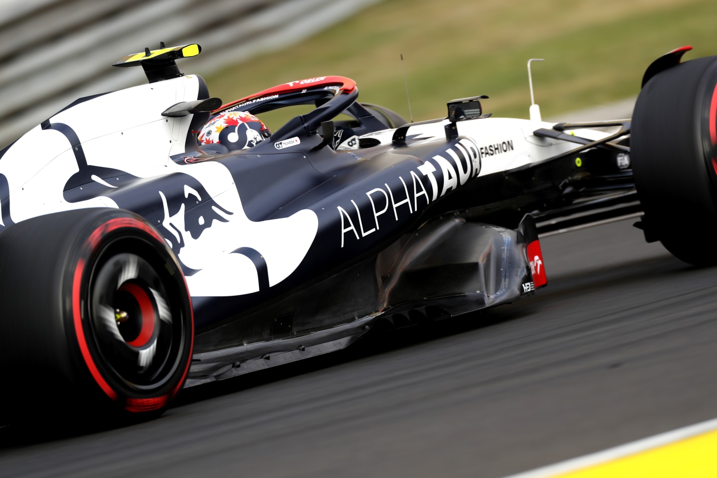 BUDAPEST, HUNGARY - JULY 21: Yuki Tsunoda of Japan driving the (22) Scuderia AlphaTauri AT04 on