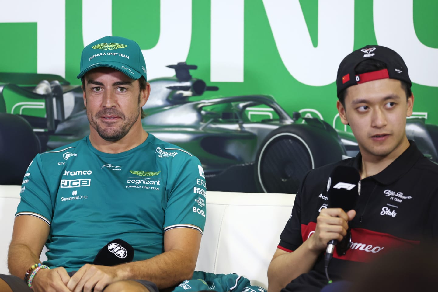 BUDAPEST, HUNGARY - JULY 20: Fernando Alonso of Spain and Aston Martin F1 Team and Zhou Guanyu of China and Alfa Romeo F1 attend the Drivers Press Conference during previews ahead of the F1 Grand Prix of Hungary at Hungaroring on July 20, 2023 in Budapest, Hungary. (Photo by Bryn Lennon/Getty Images)