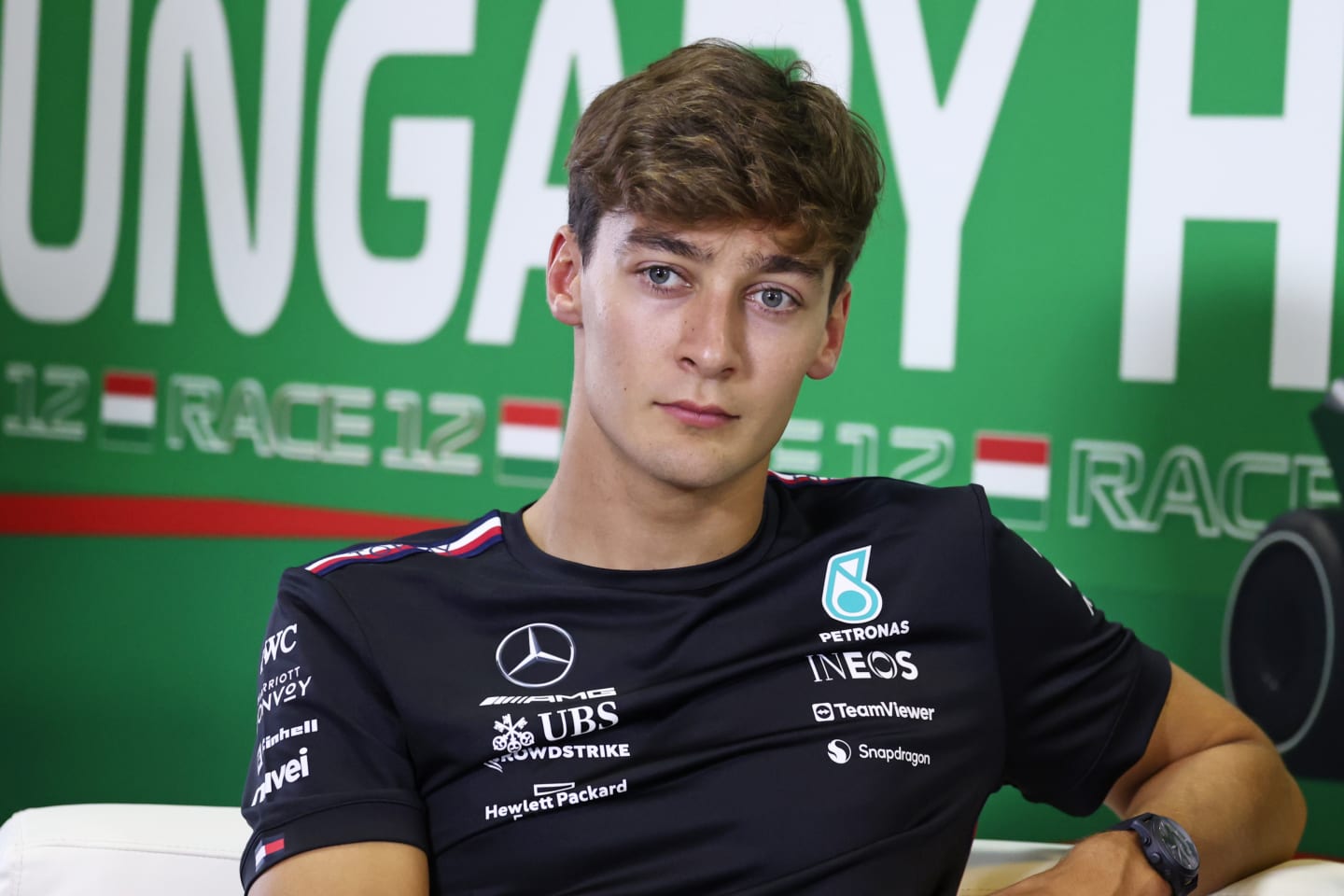 BUDAPEST, HUNGARY - JULY 20: George Russell of Great Britain and Mercedes attends the Drivers Press Conference during previews ahead of the F1 Grand Prix of Hungary at Hungaroring on July 20, 2023 in Budapest, Hungary. (Photo by Bryn Lennon/Getty Images)