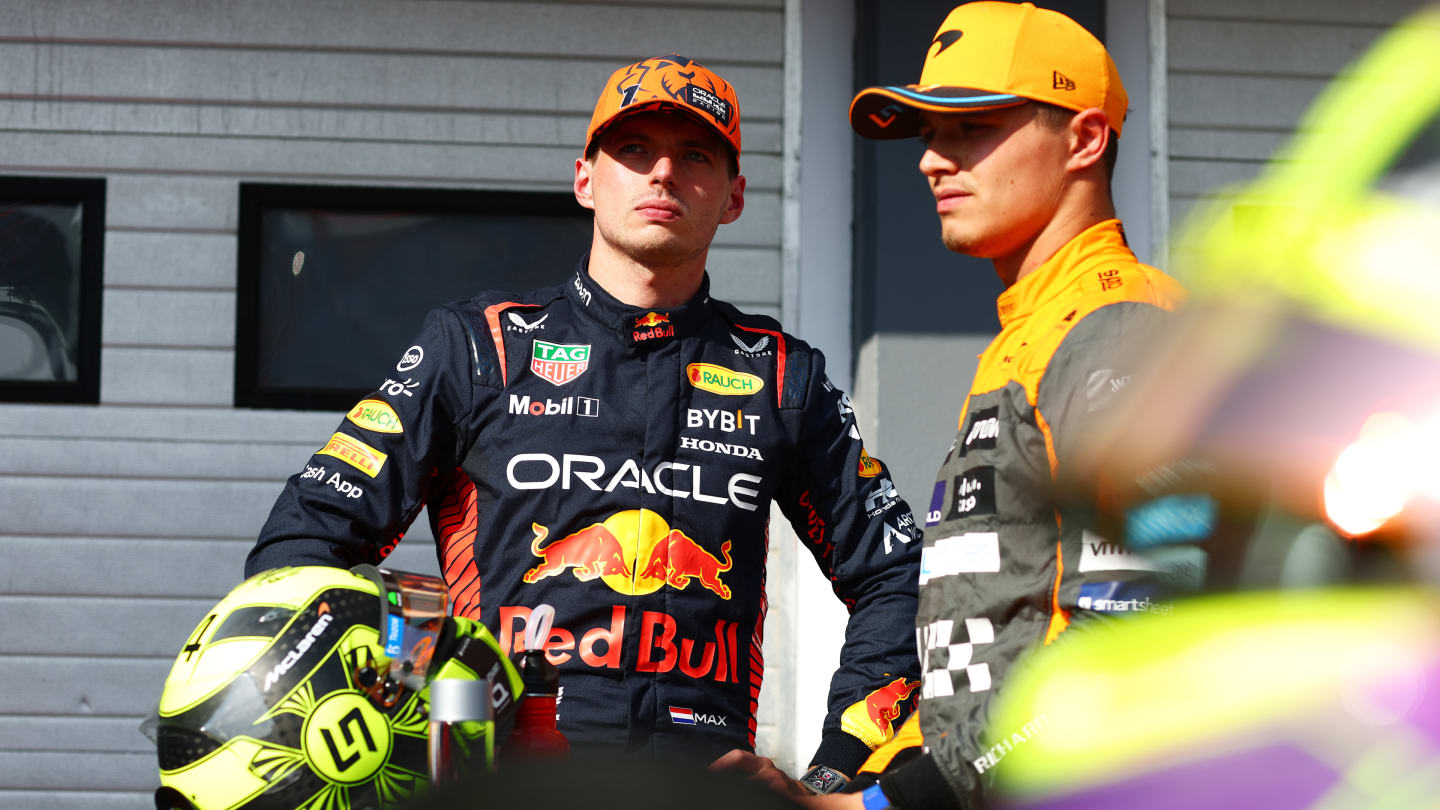 BUDAPEST, HUNGARY - JULY 22: Second placed qualifier Max Verstappen of the Netherlands and Oracle Red Bull Racing talks with Third placed qualifier Lando Norris of Great Britain and McLaren in parc ferme during qualifying ahead of the F1 Grand Prix of Hungary at Hungaroring on July 22, 2023 in Budapest, Hungary. (Photo by Dan Istitene - Formula 1/Formula 1 via Getty Images)