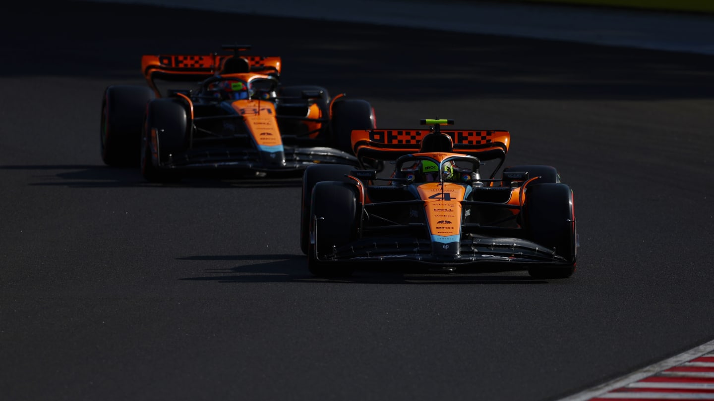 BUDAPEST, HUNGARY - JULY 22: Lando Norris of Great Britain driving the (4) McLaren MCL60 Mercedes leads Oscar Piastri of Australia driving the (81) McLaren MCL60 Mercedes on track during qualifying ahead of the F1 Grand Prix of Hungary at Hungaroring on July 22, 2023 in Budapest, Hungary. (Photo by Bryn Lennon - Formula 1/Formula 1 via Getty Images)