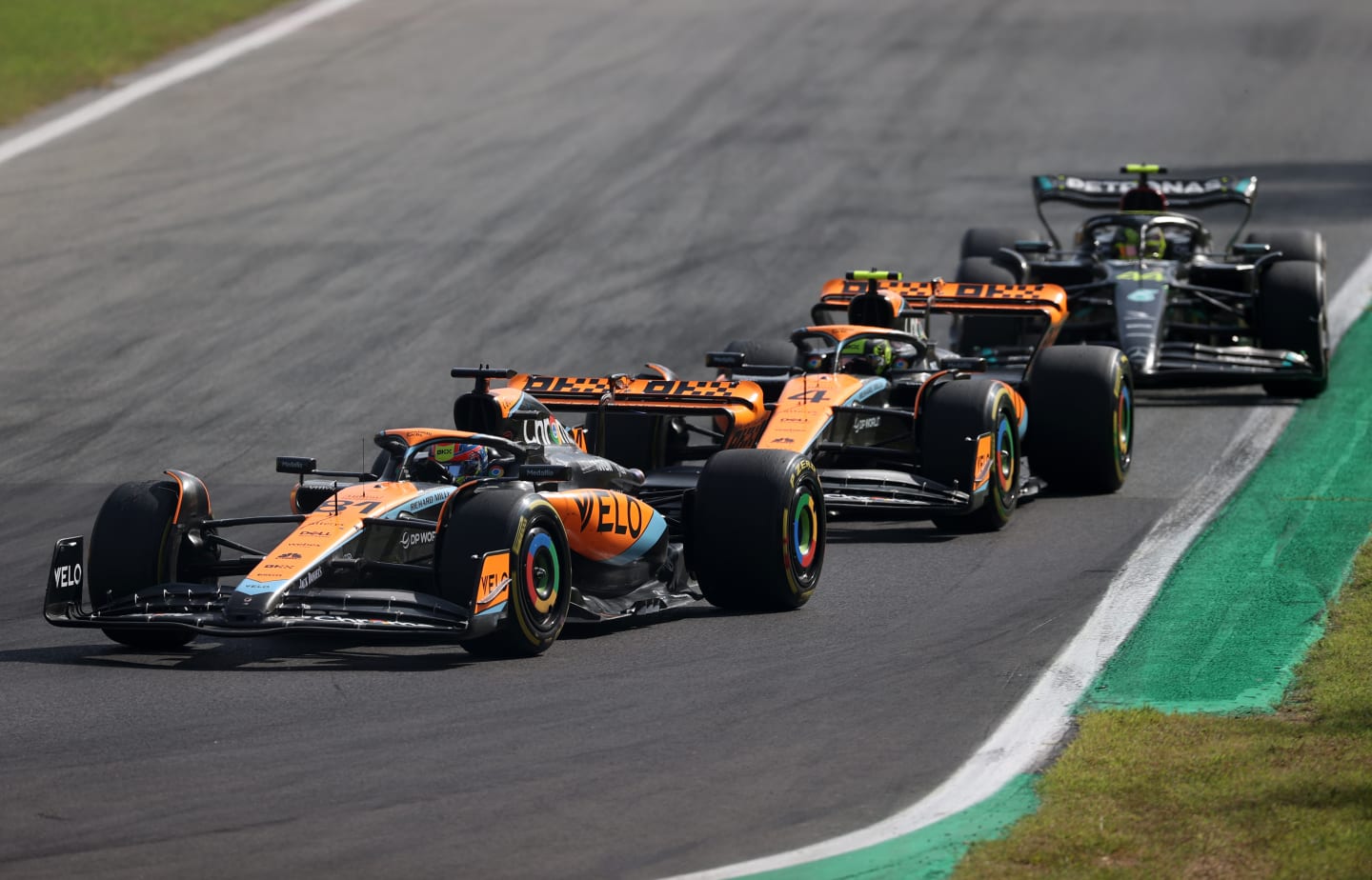 MONZA, ITALY - SEPTEMBER 03: Oscar Piastri of Australia driving the (81) McLaren MCL60 Mercedes leads Lando Norris of Great Britain driving the (4) McLaren MCL60 Mercedes during the F1 Grand Prix of Italy at Autodromo Nazionale Monza on September 03, 2023 in Monza, Italy. (Photo by Ryan Pierse/Getty Images)