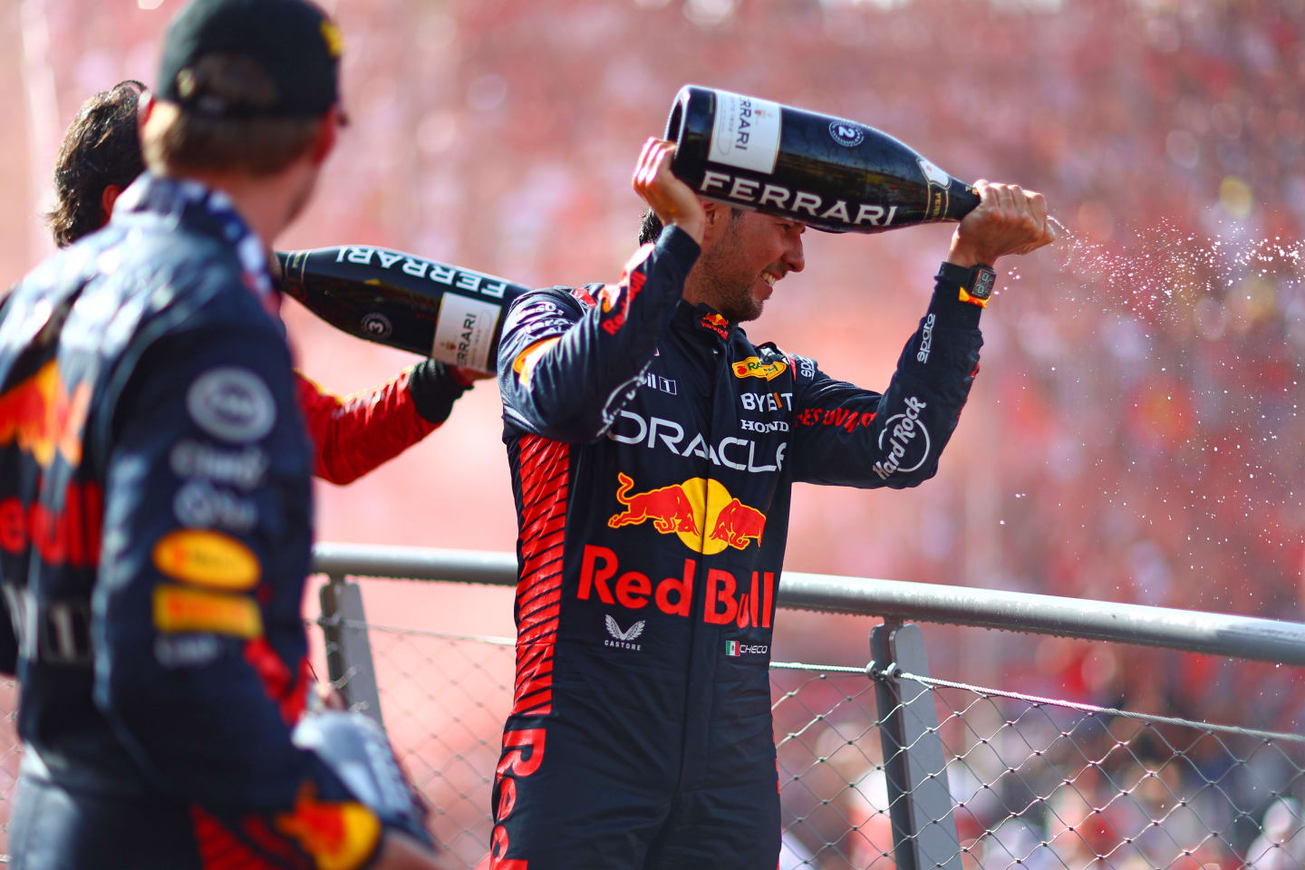 MONZA, ITALY - SEPTEMBER 03: Second placed Sergio Perez of Mexico and Oracle Red Bull Racing celebrates on the podium during the F1 Grand Prix of Italy at Autodromo Nazionale Monza on September 03, 2023 in Monza, Italy. (Photo by Dan Istitene - Formula 1/Formula 1 via Getty Images)