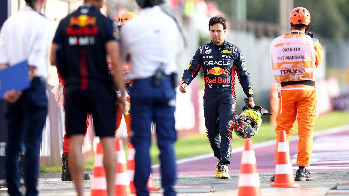 MONZA, ITALY - SEPTEMBER 01: Sergio Perez of Mexico and Oracle Red Bull Racing walks in the Pitlane after crashing during practice ahead of the F1 Grand Prix of Italy at Autodromo Nazionale Monza on September 01, 2023 in Monza, Italy. (Photo by Dan Istitene - Formula 1/Formula 1 via Getty Images)