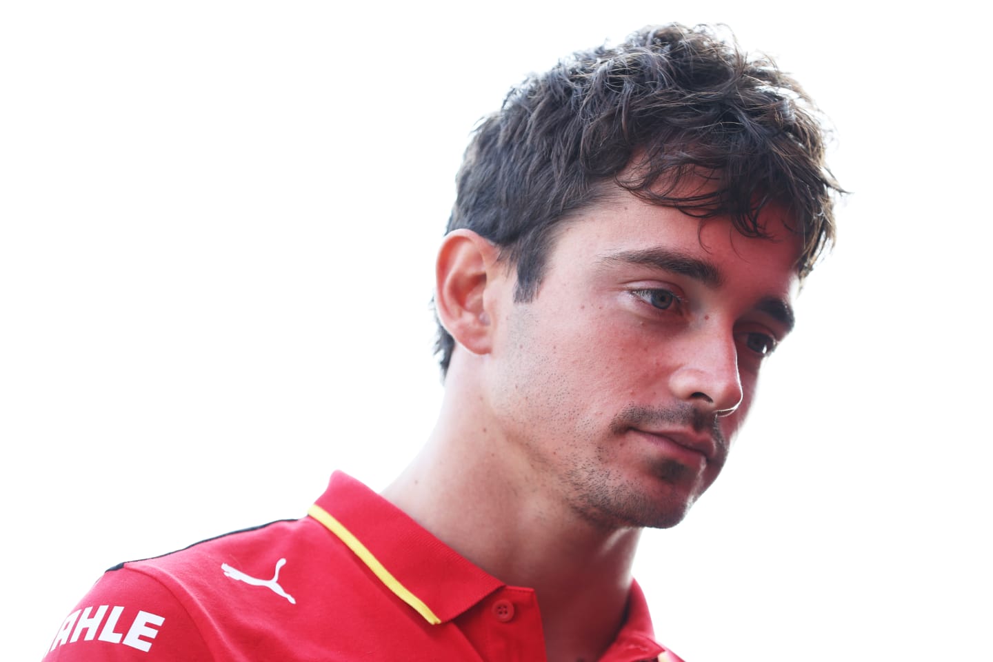 MONZA, ITALY - AUGUST 31: Charles Leclerc of Monaco and Ferrari looks on in the Paddock during