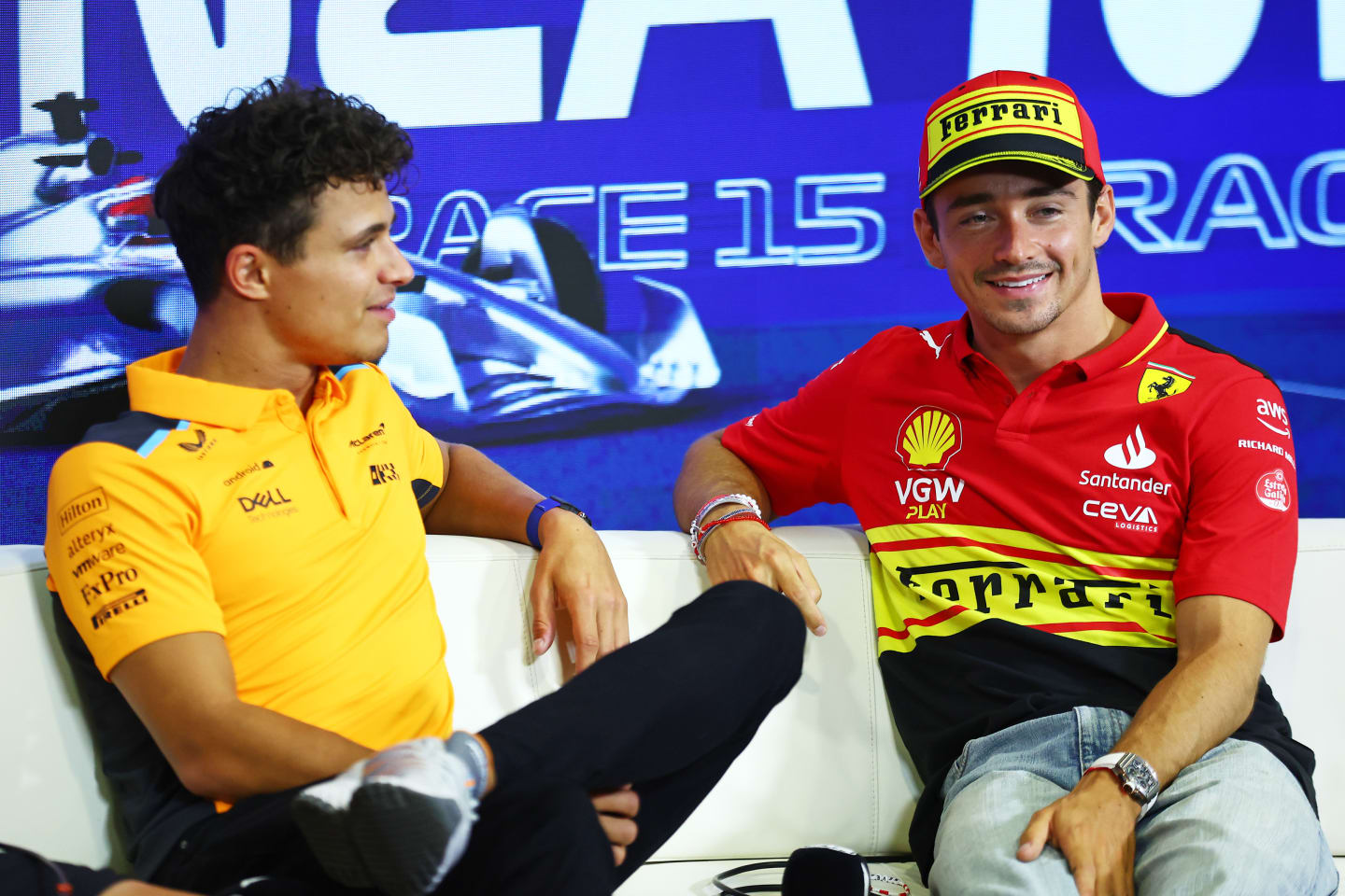 MONZA, ITALY - AUGUST 31: Charles Leclerc of Monaco and Ferrari and Lando Norris of Great Britain and McLaren talk in the Drivers Press Conference during previews ahead of the F1 Grand Prix of Italy at Autodromo Nazionale Monza on August 31, 2023 in Monza, Italy. (Photo by Bryn Lennon/Getty Images)