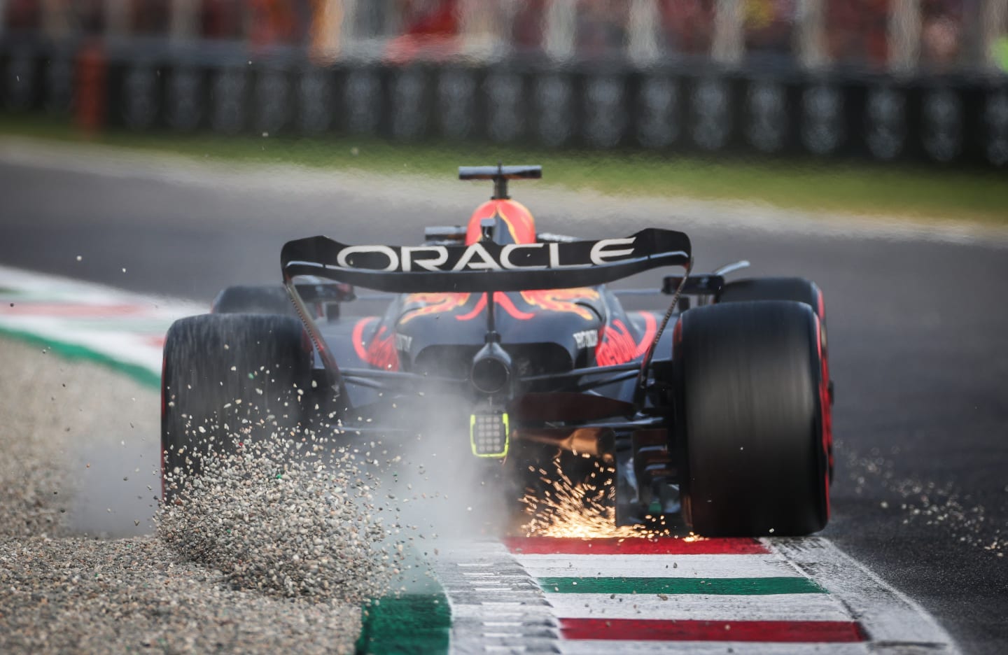 MONZA, ITALY - SEPTEMBER 02: Max Verstappen of the Netherlands driving the (1) Oracle Red Bull Racing RB19 kicks up gravel during qualifying ahead of the F1 Grand Prix of Italy at Autodromo Nazionale Monza on September 02, 2023 in Monza, Italy. (Photo by Ryan Pierse/Getty Images)