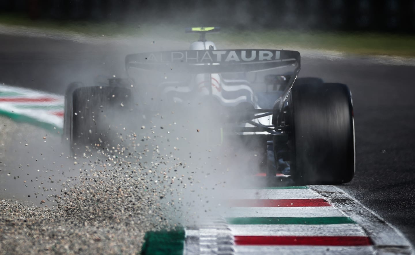 MONZA, ITALY - SEPTEMBER 02: Yuki Tsunoda of Japan driving the (22) Scuderia AlphaTauri AT04 on track kicks up gravelduring qualifying ahead of the F1 Grand Prix of Italy at Autodromo Nazionale Monza on September 02, 2023 in Monza, Italy. (Photo by Ryan Pierse/Getty Images)