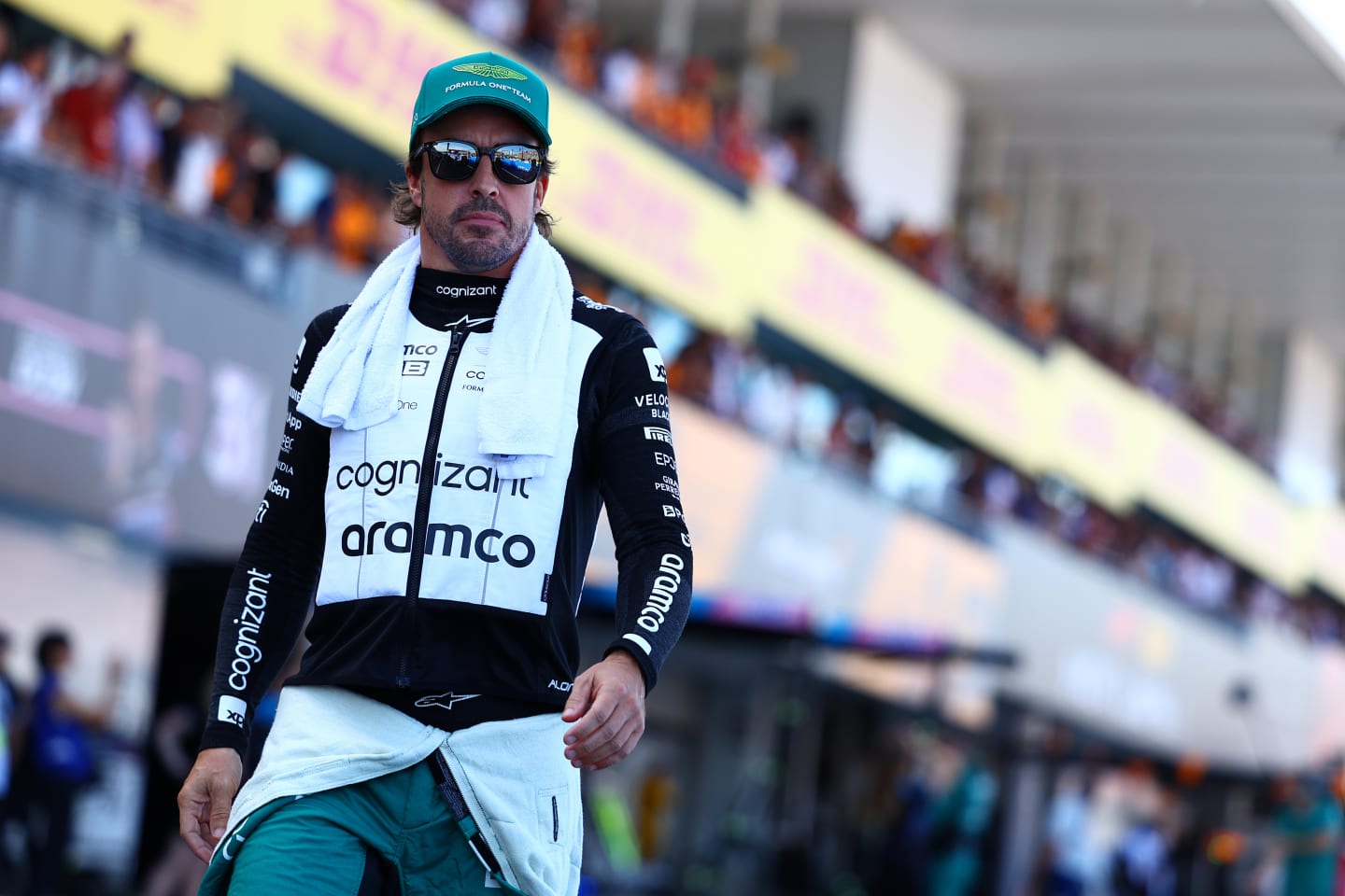 SUZUKA, JAPAN - SEPTEMBER 24: Fernando Alonso of Spain and Aston Martin F1 Team walks in the Pitlane prior to the F1 Grand Prix of Japan at Suzuka International Racing Course on September 24, 2023 in Suzuka, Japan. (Photo by Mark Thompson/Getty Images)