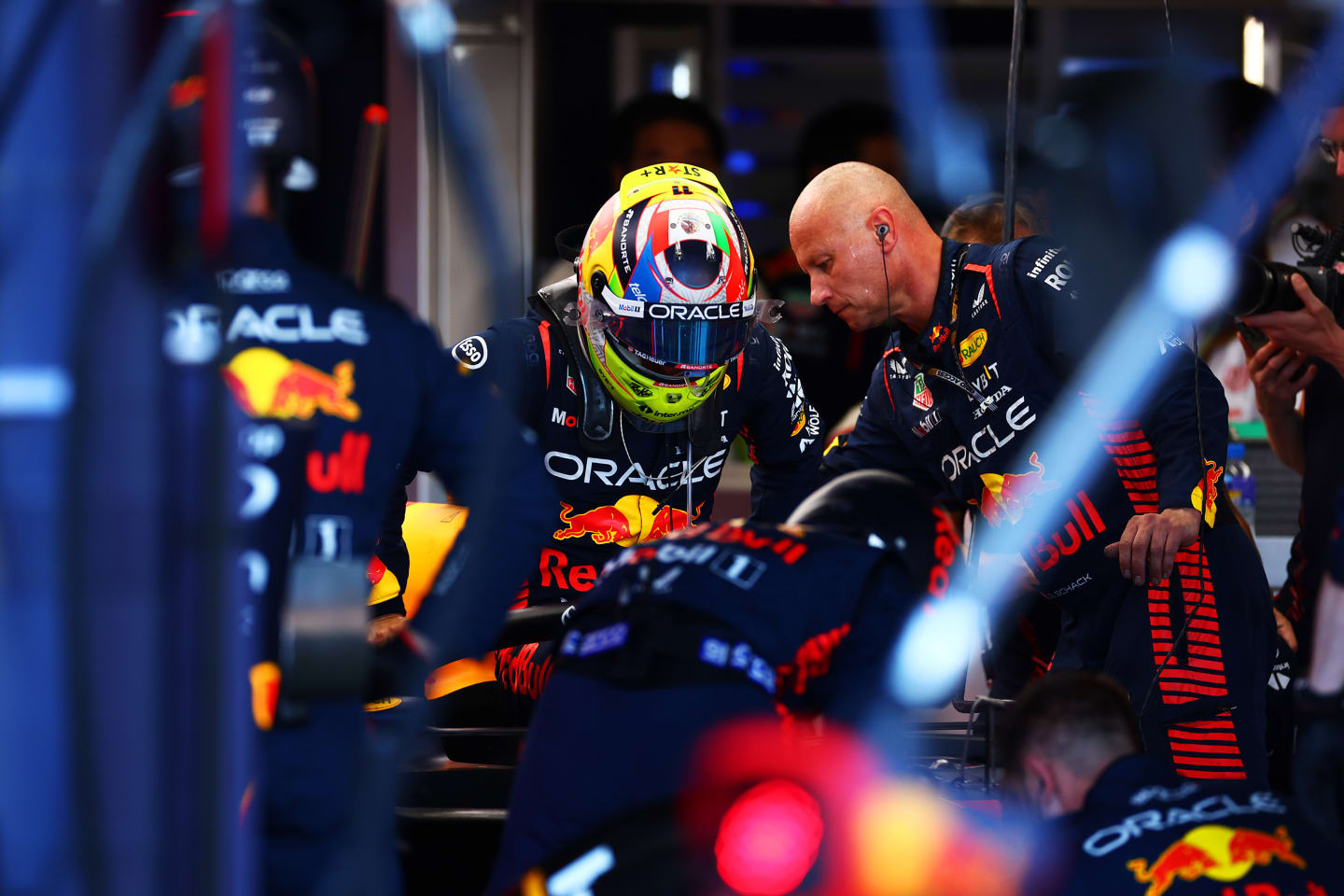 SUZUKA, JAPAN - SEPTEMBER 24: Sergio Perez of Mexico and Oracle Red Bull Racing sits in his car after returning to the garage during the F1 Grand Prix of Japan at Suzuka International Racing Course on September 24, 2023 in Suzuka, Japan. (Photo by Dan Istitene - Formula 1/Formula 1 via Getty Images)