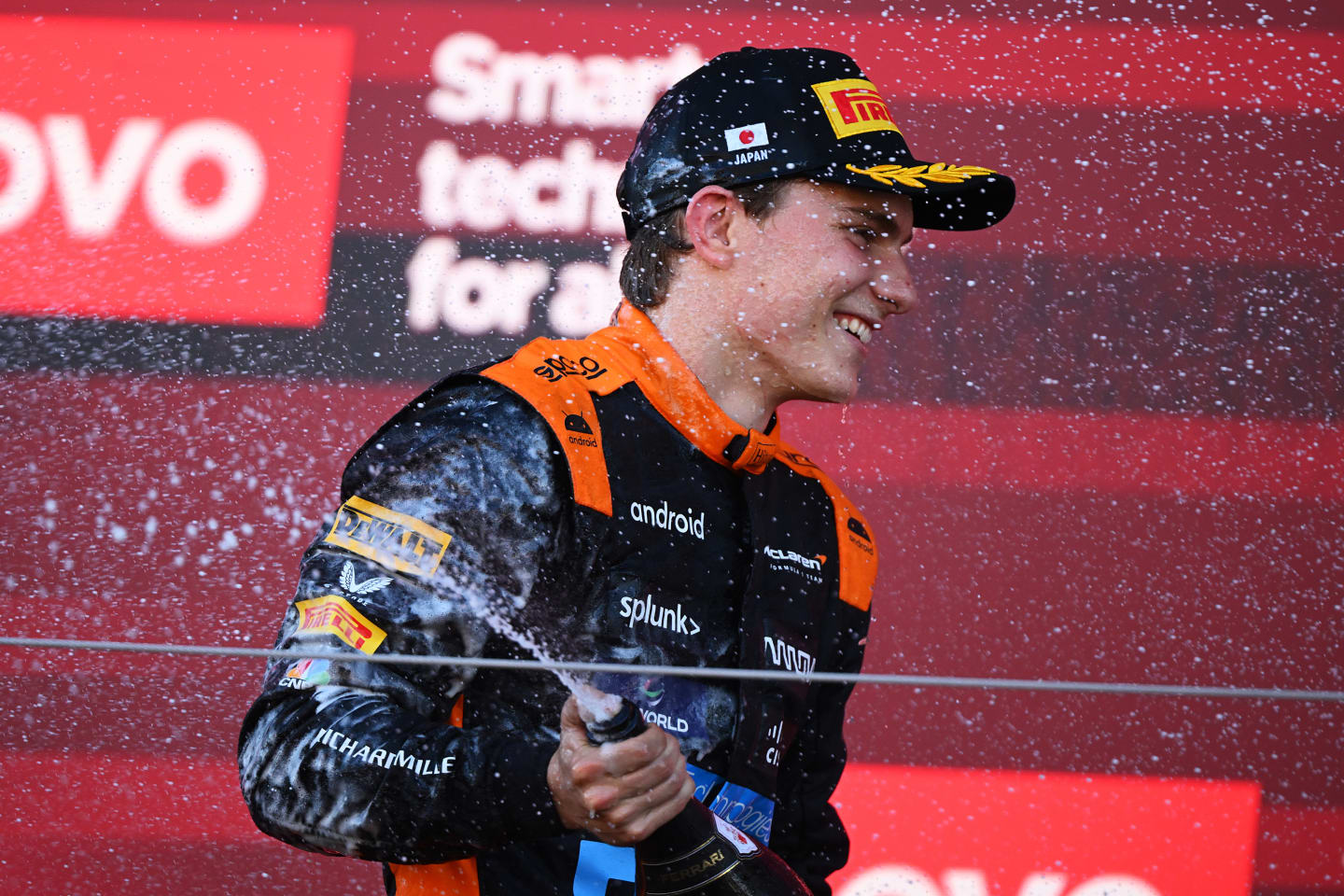 SUZUKA, JAPAN - SEPTEMBER 24: Third placed Oscar Piastri of Australia and McLaren celebrates on the podium during the F1 Grand Prix of Japan at Suzuka International Racing Course on September 24, 2023 in Suzuka, Japan. (Photo by Clive Mason/Getty Images)