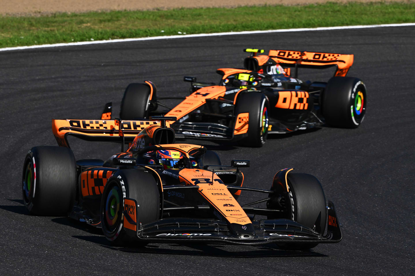 SUZUKA, JAPAN - SEPTEMBER 24: Oscar Piastri of Australia driving the (81) McLaren MCL60 Mercedes leads Lando Norris of Great Britain driving the (4) McLaren MCL60 Mercedes during the F1 Grand Prix of Japan at Suzuka