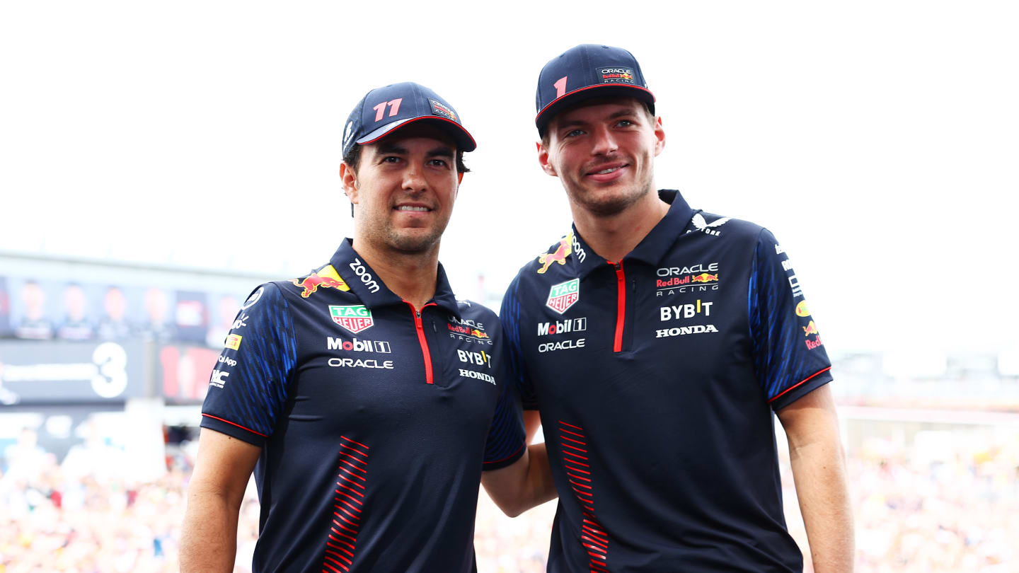 SUZUKA, JAPAN - SEPTEMBER 23: Sergio Perez of Mexico and Oracle Red Bull Racing and Max Verstappen