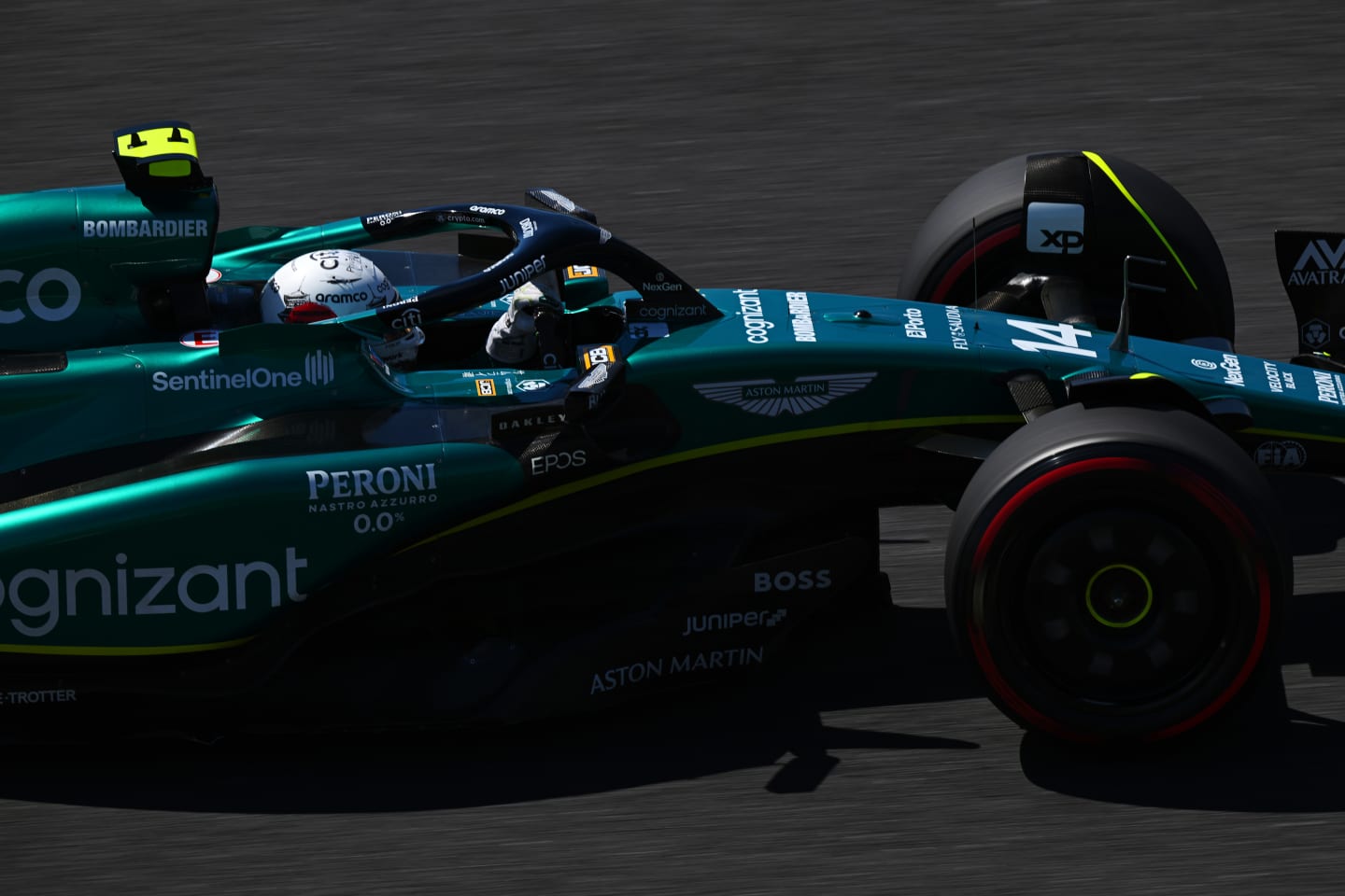 SUZUKA, JAPAN - SEPTEMBER 23: Fernando Alonso of Spain driving the (14) Aston Martin AMR23 Mercedes