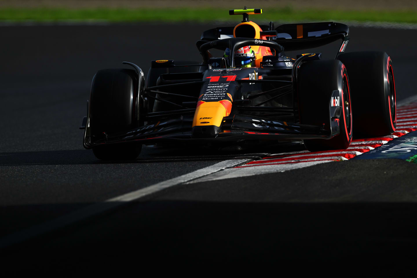 SUZUKA, JAPAN - SEPTEMBER 23: Sergio Perez of Mexico driving the (11) Oracle Red Bull Racing RB19 on track during qualifying ahead of the F1 Grand Prix of Japan at Suzuka International Racing Course on September 23, 2023 in Suzuka, Japan. (Photo by Clive Mason/Getty Images)