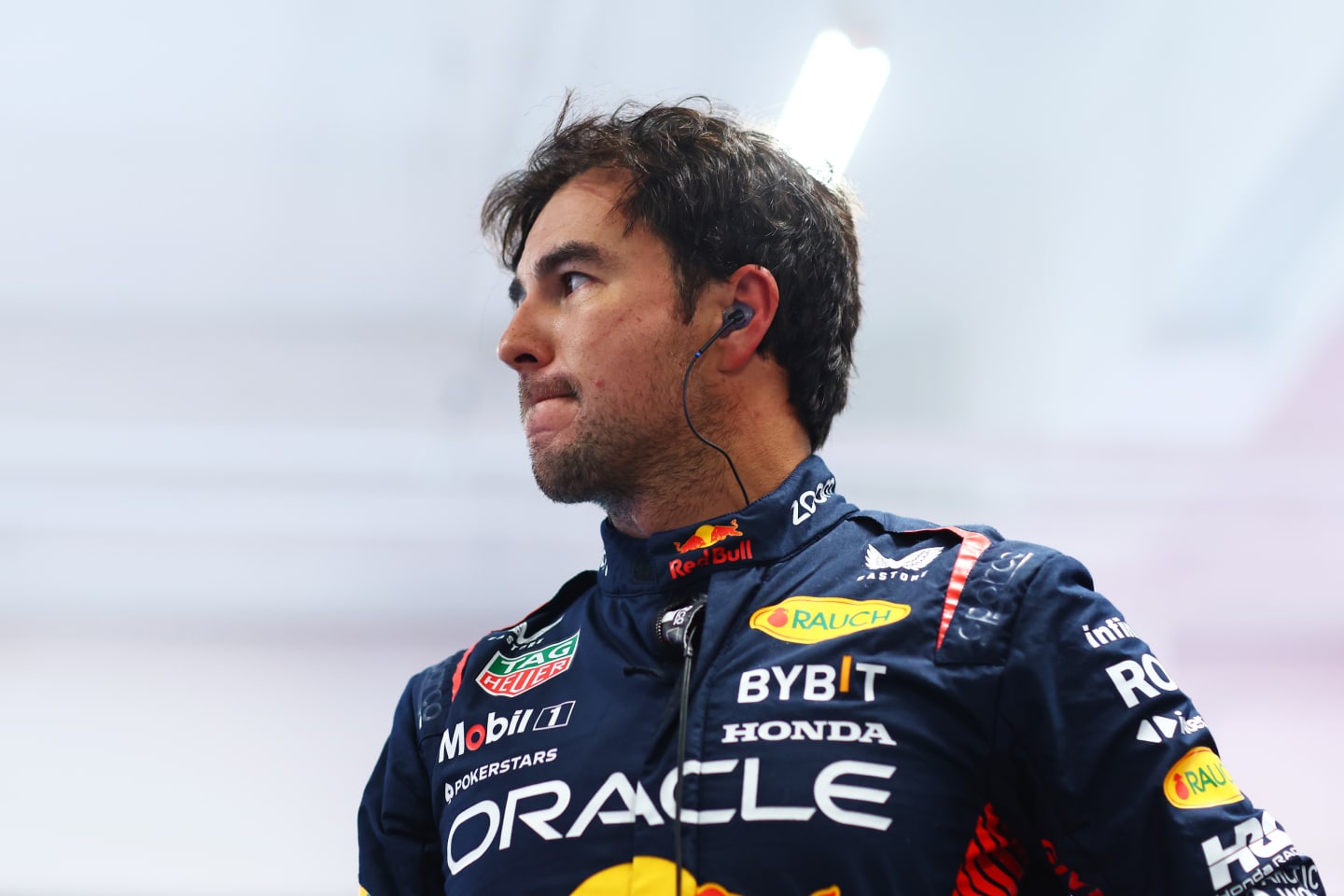 LAS VEGAS, NEVADA - NOVEMBER 18: Twelfth placed qualifier Sergio Perez of Mexico and Oracle Red Bull Racing looks on in the FIA Garage after qualifying ahead of the F1 Grand Prix of Las Vegas at Las Vegas Strip Circuit on November 18, 2023 in Las Vegas, Nevada. (Photo by Dan Istitene - Formula 1/Formula 1 via Getty Images)