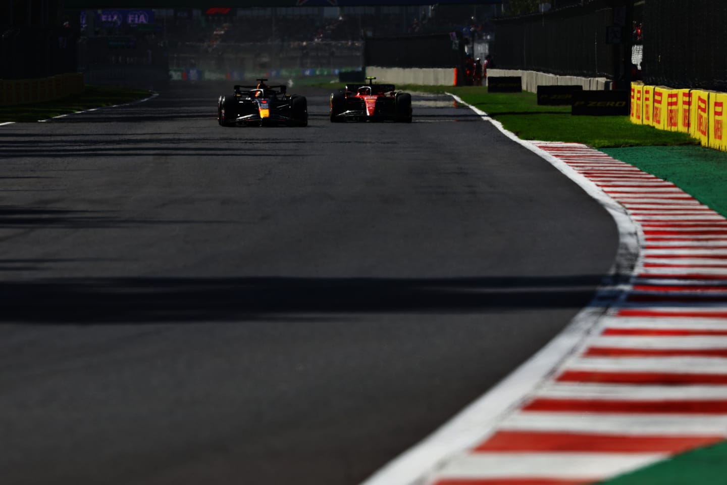 MEXICO CITY, MEXICO - OCTOBER 29: Max Verstappen of the Netherlands driving the (1) Oracle Red Bull Racing RB19 overtakes Carlos Sainz of Spain driving (55) the Ferrari SF-23 during the F1 Grand Prix of Mexico at Autodromo Hermanos Rodriguez on October 29, 2023 in Mexico City, Mexico. (Photo by Mark Thompson/Getty Images)