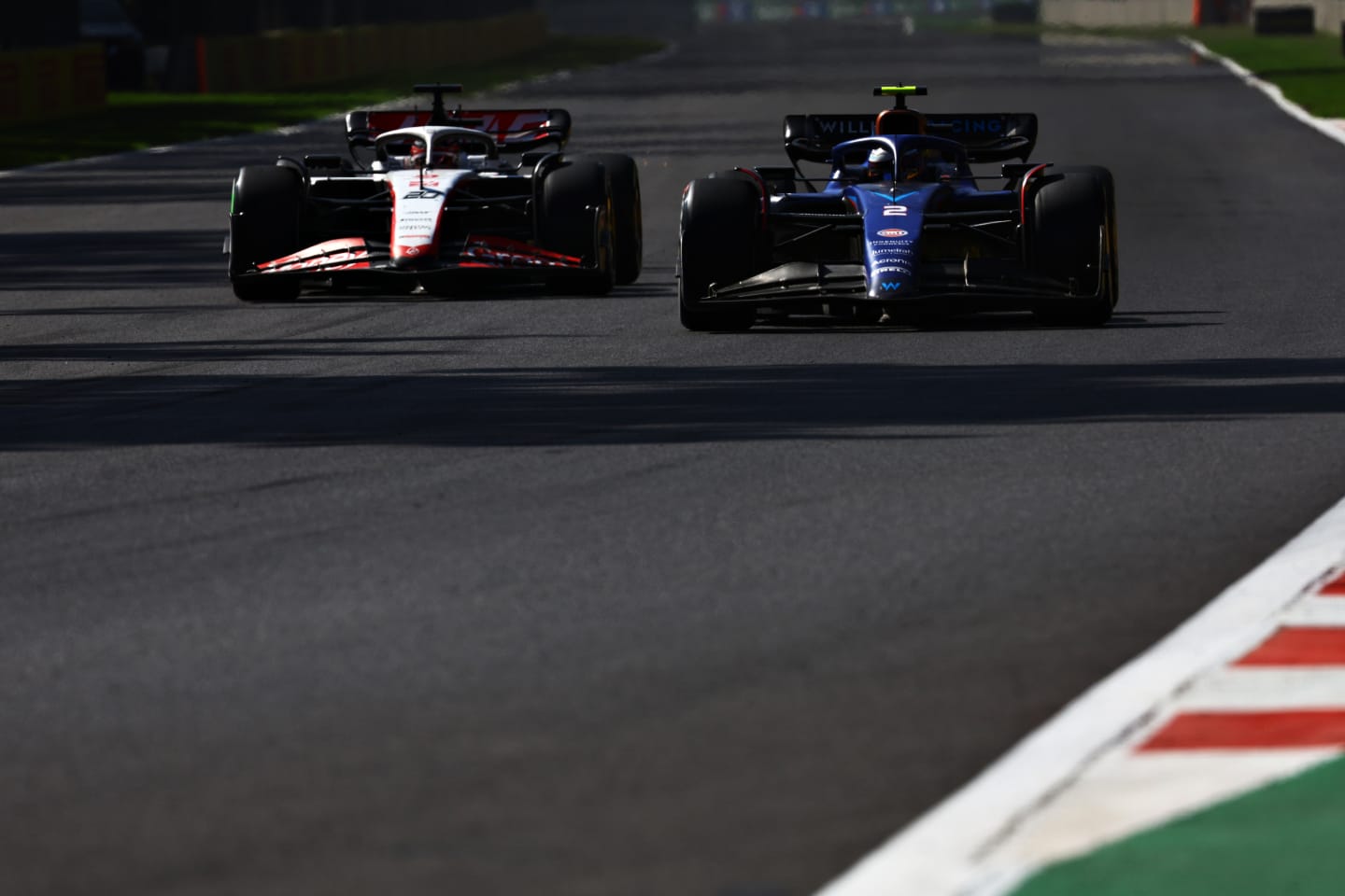MEXICO CITY, MEXICO - OCTOBER 29: Logan Sargeant of United States driving the (2) Williams FW45 Mercedes leads Kevin Magnussen of Denmark driving the (20) Haas F1 VF-23 Ferrari during the F1 Grand Prix of Mexico at Autodromo Hermanos Rodriguez on October 29, 2023 in Mexico City, Mexico. (Photo by Mark Thompson/Getty Images)