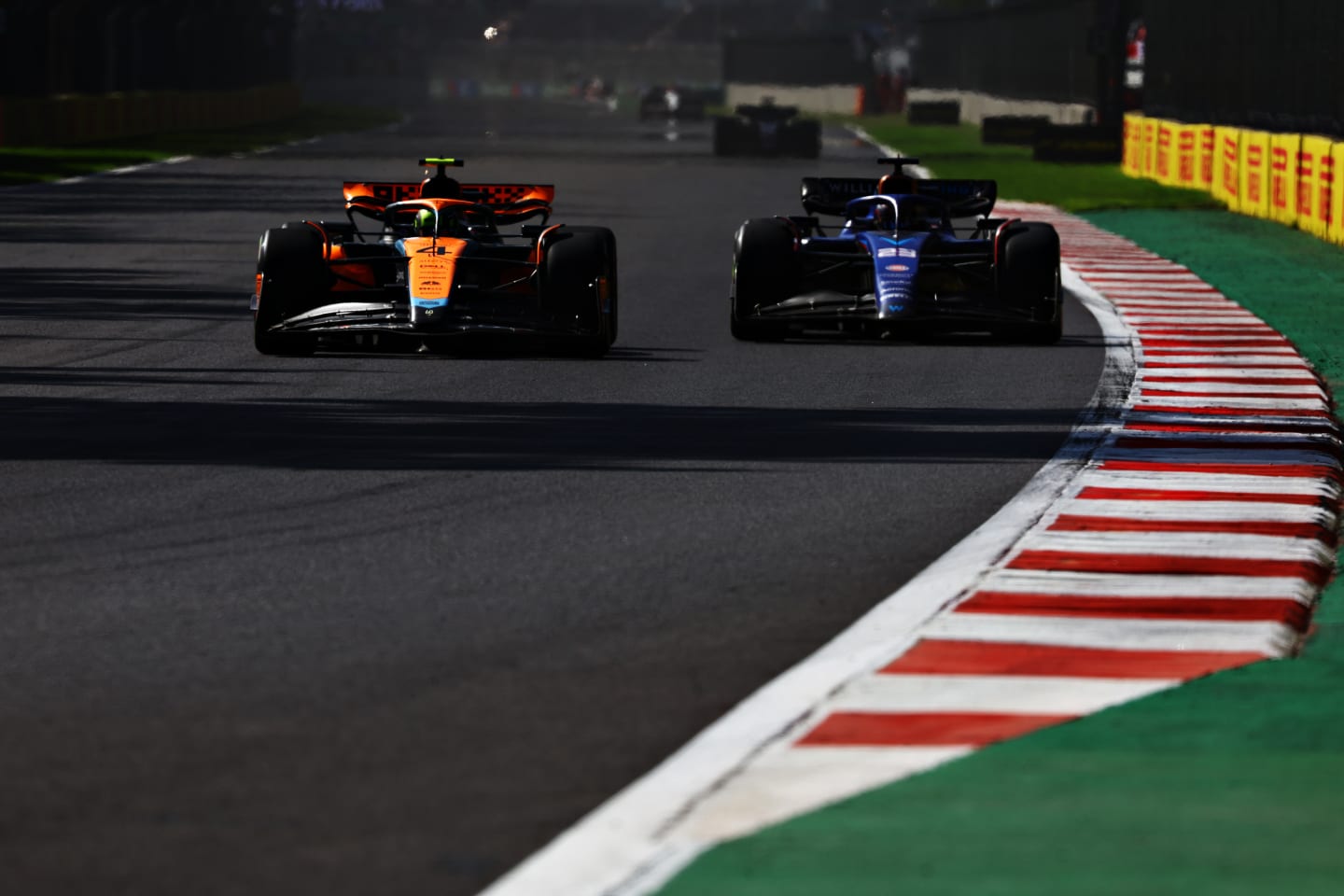 MEXICO CITY, MEXICO - OCTOBER 29: Lando Norris of Great Britain driving the (4) McLaren MCL60 Mercedes leads Alexander Albon of Thailand driving the (23) Williams FW45 Mercedes during the F1 Grand Prix of Mexico at Autodromo Hermanos Rodriguez on October 29, 2023 in Mexico City, Mexico. (Photo by Mark Thompson/Getty Images)