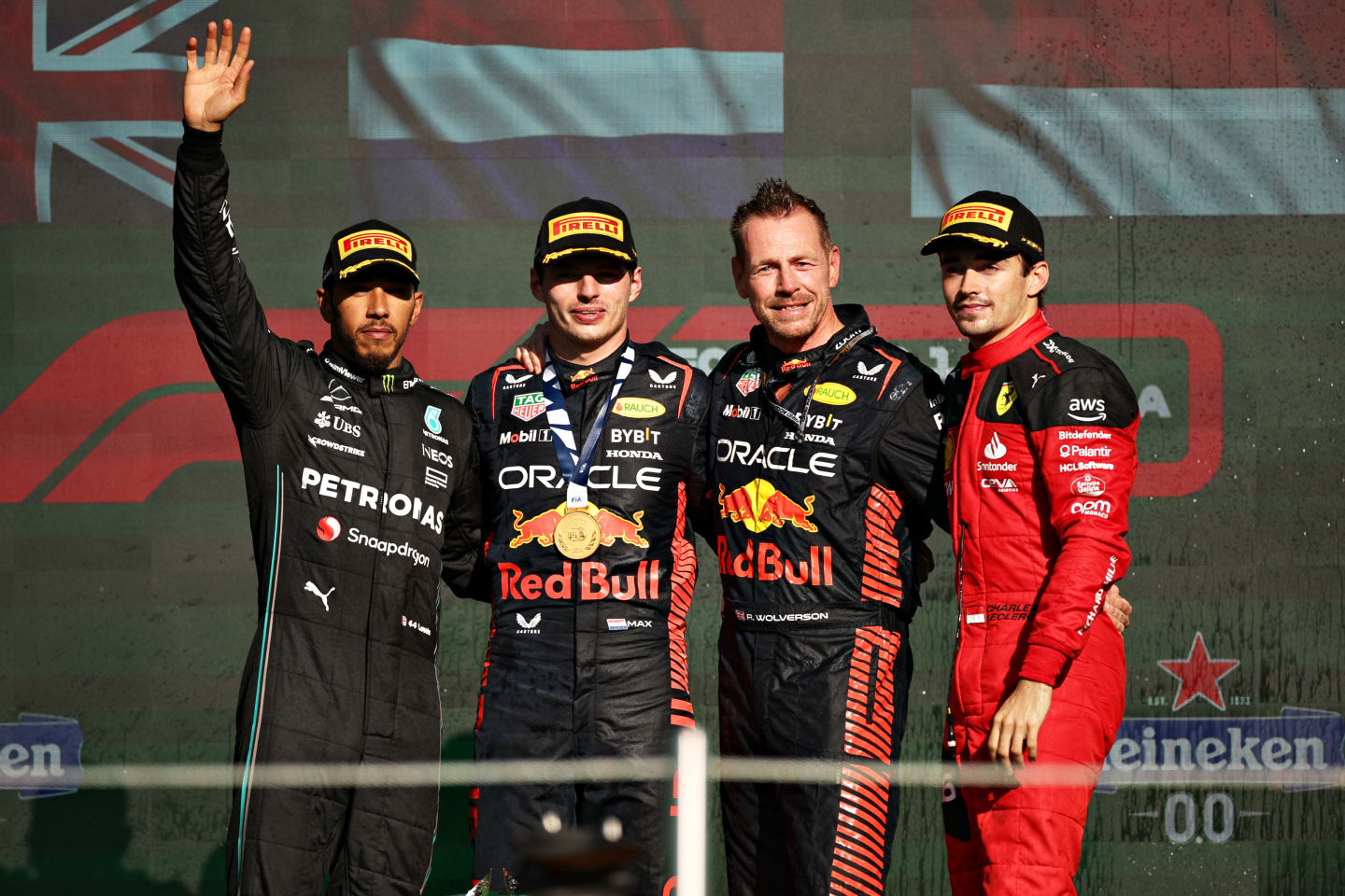 MEXICO CITY, MEXICO - OCTOBER 29: Race winner Max Verstappen of the Netherlands and Oracle Red Bull Racing, Second placed Lewis Hamilton of Great Britain and Mercedes, Third placed Charles Leclerc of Monaco and Ferrari  and Richard Wolverson of Red Bull Racing celebrate on the podium after the F1 Grand Prix of Mexico at Autodromo Hermanos Rodriguez on October 29, 2023 in Mexico City, Mexico. (Photo by Jared C. Tilton/Getty Images)