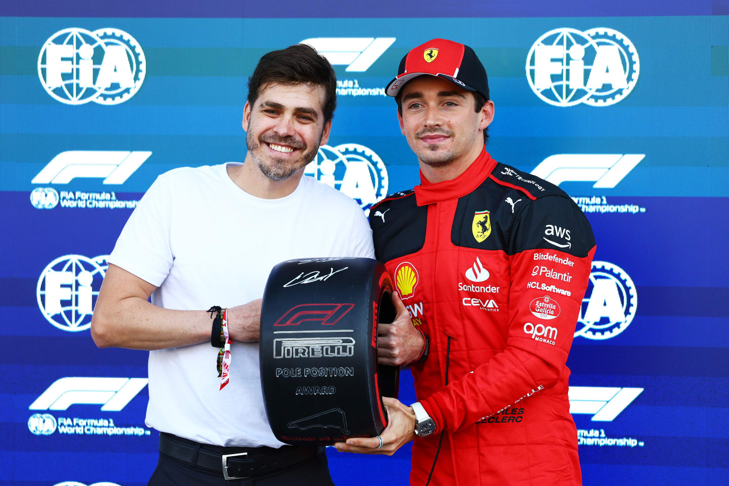 MEXICO CITY, MEXICO - OCTOBER 28: Pole position qualifier Charles Leclerc of Monaco and Ferrari is presented with the Pirelli Pole Position Award. by Jimmy Alvarez in parc ferme during qualifying ahead of the F1 Grand Prix of Mexico at Autodromo Hermanos Rodriguez on October 28, 2023 in Mexico City, Mexico. (Photo by Mark Thompson/Getty Images)