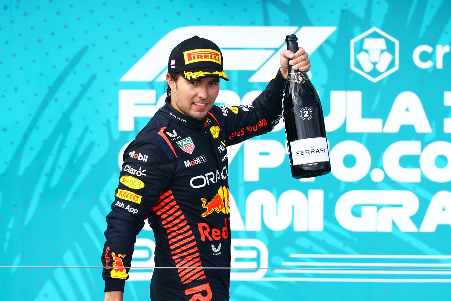 MIAMI, FLORIDA - MAY 07: Second placed Sergio Perez of Mexico and Oracle Red Bull Racing celebrates on the podium during the F1 Grand Prix of Miami at Miami International Autodrome on May 07, 2023 in Miami, Florida. (Photo by Mark Thompson/Getty Images)