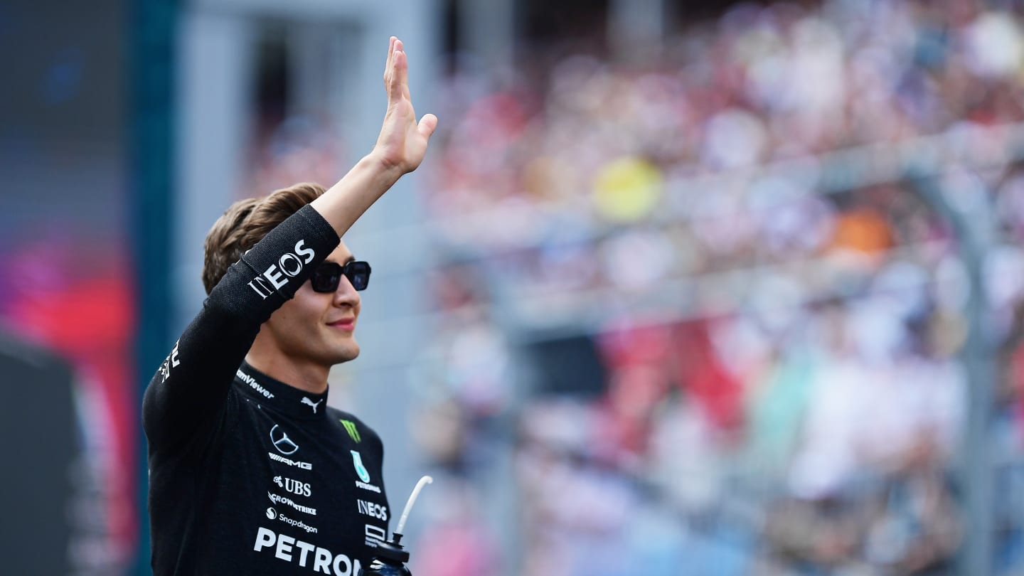 MIAMI, FLORIDA - MAY 07: George Russell of Great Britain and Mercedes walks on the grid prior to