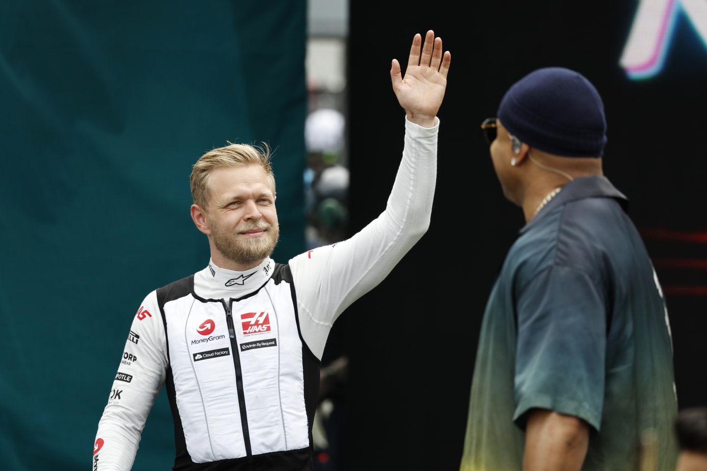 MIAMI, FLORIDA - MAY 07: Kevin Magnussen of Denmark and Haas F1 walks on the grid prior to the F1