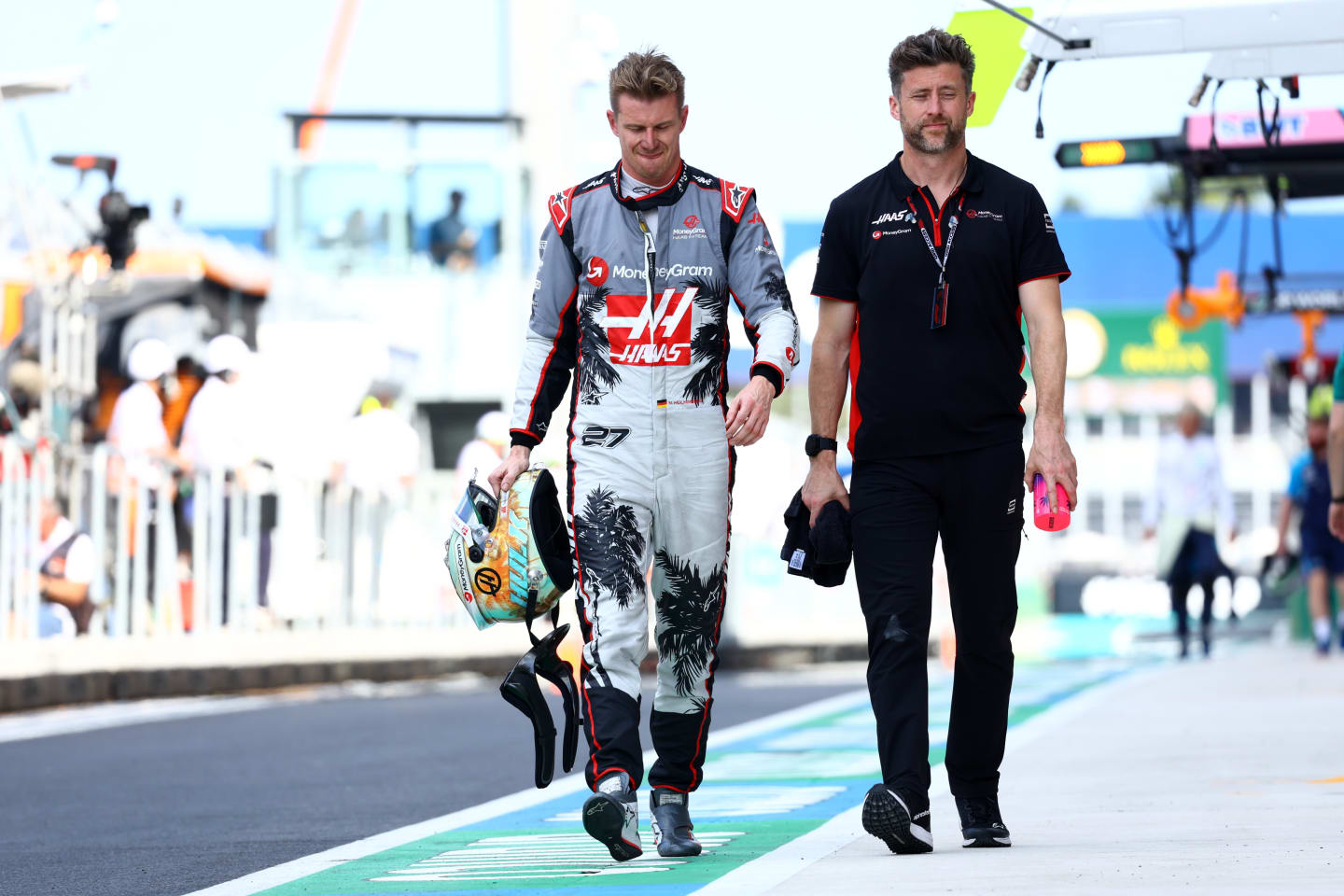 MIAMI, FLORIDA - MAY 06: 12th placed qualifier Nico Hulkenberg of Germany and Haas F1 walks in the Pitlane during qualifying ahead of the F1 Grand Prix of Miami at Miami International Autodrome on May 06, 2023 in Miami, Florida. (Photo by Mark Thompson/Getty Images)