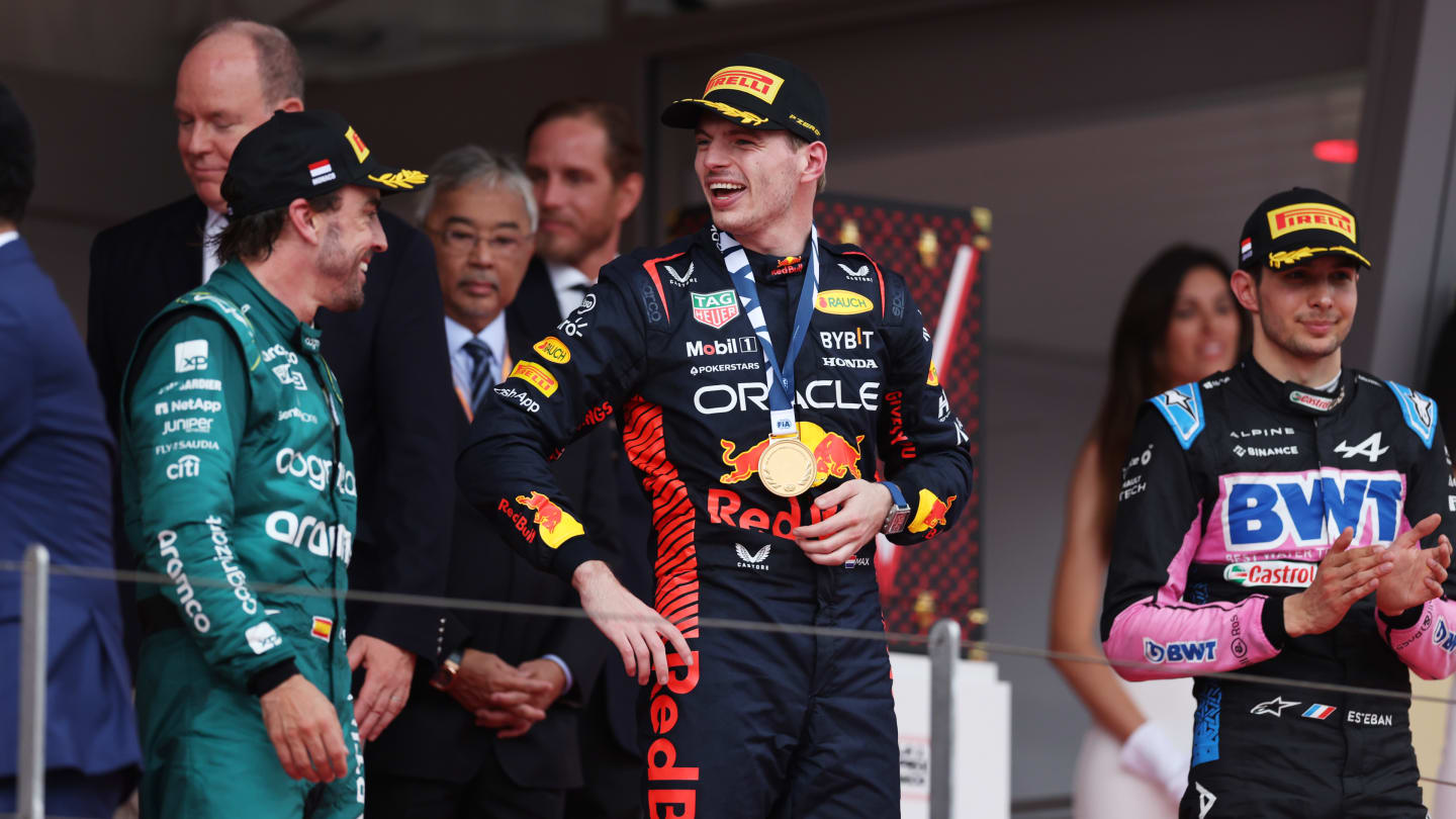 MONTE-CARLO, MONACO - MAY 28: Race winner Max Verstappen of the Netherlands and Oracle Red Bull Racing, Second placed Fernando Alonso of Spain and Aston Martin F1 Team and Third placed Esteban Ocon of France and Alpine F1 celebrate on the podium during the F1 Grand Prix of Monaco at Circuit de Monaco on May 28, 2023 in Monte-Carlo, Monaco. (Photo by Bryn Lennon - Formula 1/Formula 1 via Getty Images)