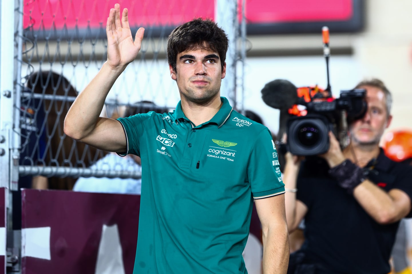 LUSAIL CITY, QATAR - OCTOBER 08: Lance Stroll of Canada and Aston Martin F1 Team waves to the crowd on the drivers parade prior to the F1 Grand Prix of Qatar at Lusail International Circuit on October 08, 2023 in Lusail City, Qatar. (Photo by Clive Rose/Getty Images)