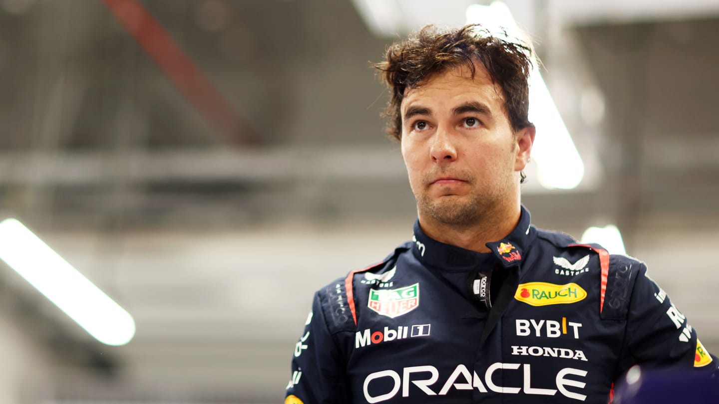 LUSAIL CITY, QATAR - OCTOBER 06: 13th placed qualifier Sergio Perez of Mexico and Oracle Red Bull Racing looks on in the FIA garage during qualifying ahead of the F1 Grand Prix of Qatar at Lusail International Circuit on October 06, 2023 in Lusail City, Qatar. (Photo by Dan Istitene - Formula 1/Formula 1 via Getty Images)