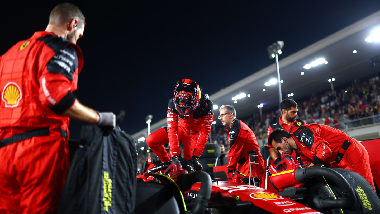 LUSAIL CITY, QATAR - OCTOBER 07: Carlos Sainz of Spain and Ferrari prepares to drive on the grid during the Sprint ahead of the F1 Grand Prix of Qatar at Lusail International Circuit on October 07, 2023 in Lusail City, Qatar. (Photo by Dan Istitene - Formula 1/Formula 1 via Getty Images)