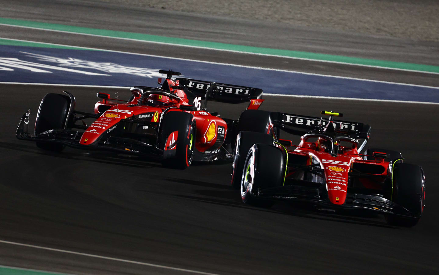 LUSAIL CITY, QATAR - OCTOBER 07: Carlos Sainz of Spain driving (55) the Ferrari SF-23 leads Charles Leclerc of Monaco driving the (16) Ferrari SF-23 during the Sprint ahead of the F1 Grand Prix of Qatar at Lusail International Circuit on October 07, 2023 in Lusail City, Qatar. (Photo by Clive Rose/Getty Images)