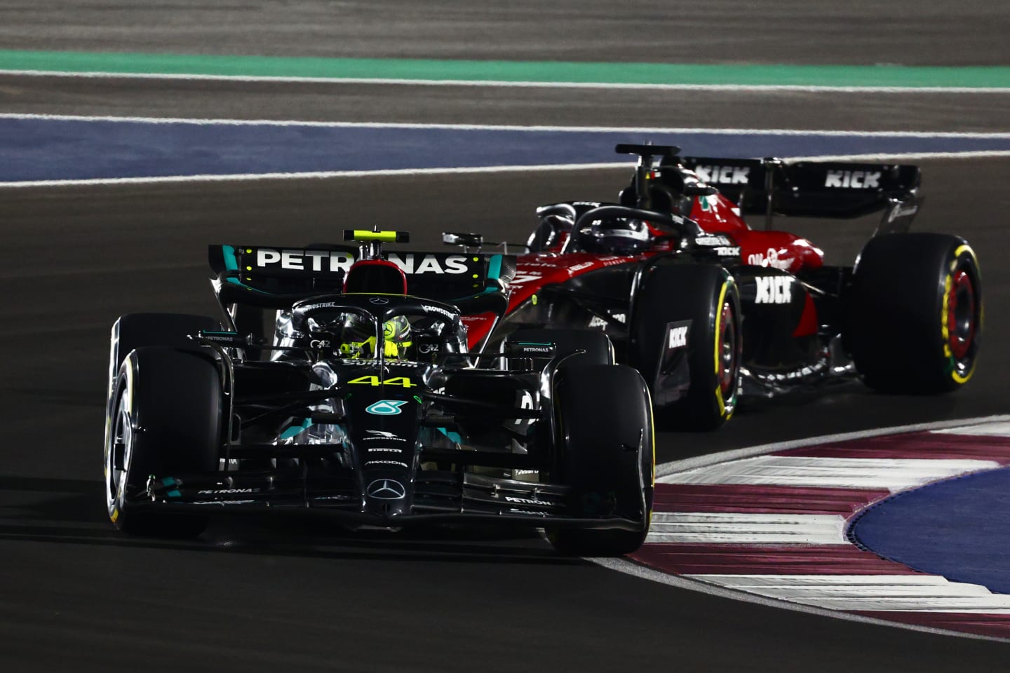 LUSAIL CITY, QATAR - OCTOBER 07: Lewis Hamilton of Great Britain driving the (44) Mercedes AMG Petronas F1 Team W14 leads Valtteri Bottas of Finland driving the (77) Alfa Romeo F1 C43 Ferrari during the Sprint ahead of the F1 Grand Prix of Qatar at Lusail International Circuit on October 07, 2023 in Lusail City, Qatar. (Photo by Clive Rose/Getty Images)