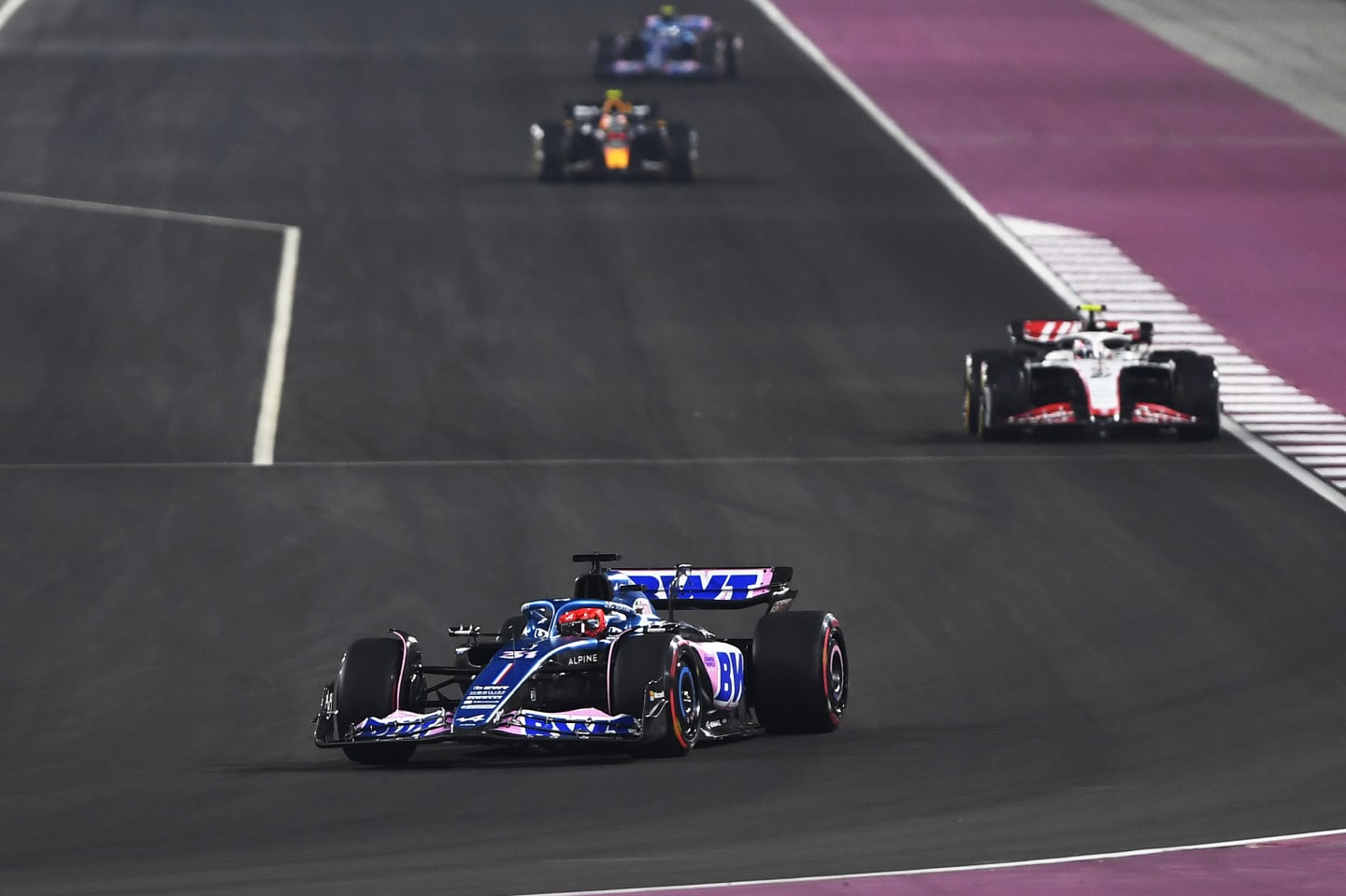 LUSAIL CITY, QATAR - OCTOBER 07: Esteban Ocon of France driving the (31) Alpine F1 A523 Renault leads Nico Hulkenberg of Germany driving the (27) Haas F1 VF-23 Ferrari during the Sprint ahead of the F1 Grand Prix of Qatar at Lusail International Circuit on October 07, 2023 in Lusail City, Qatar. (Photo by Rudy Carezzevoli/Getty Images)