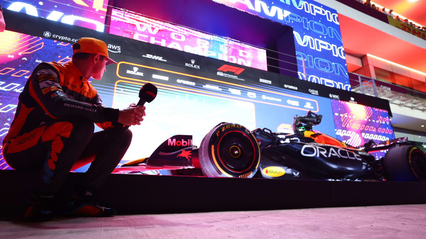 LUSAIL CITY, QATAR - OCTOBER 07: Third placed Lando Norris of Great Britain and McLaren looks at the car of Max Verstappen of the Netherlands and Oracle Red Bull Racing (not pictured) in parc ferme during the Sprint ahead of the F1 Grand Prix of Qatar at Lusail International Circuit on October 07, 2023 in Lusail City, Qatar. (Photo by Dan Istitene - Formula 1/Formula 1 via Getty Images)