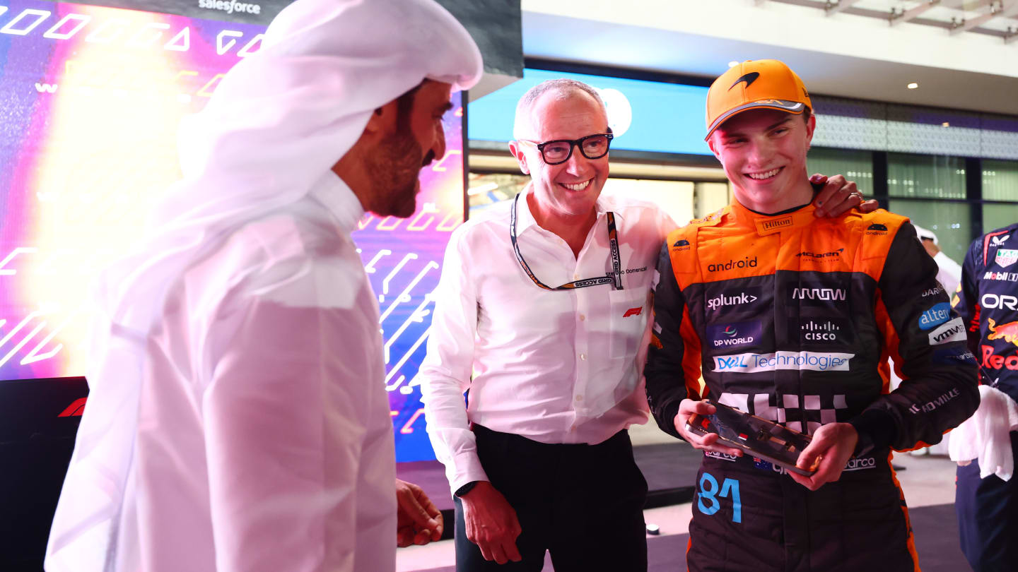 LUSAIL CITY, QATAR - OCTOBER 07: Sprint winner Oscar Piastri of Australia and McLaren is congratulated by Stefano Domenicali, CEO of the Formula One Group, in parc ferme after the Sprint ahead of the F1 Grand Prix of Qatar at Lusail International Circuit on October 07, 2023 in Lusail City, Qatar. (Photo by Dan Istitene - Formula 1/Formula 1 via Getty Images)