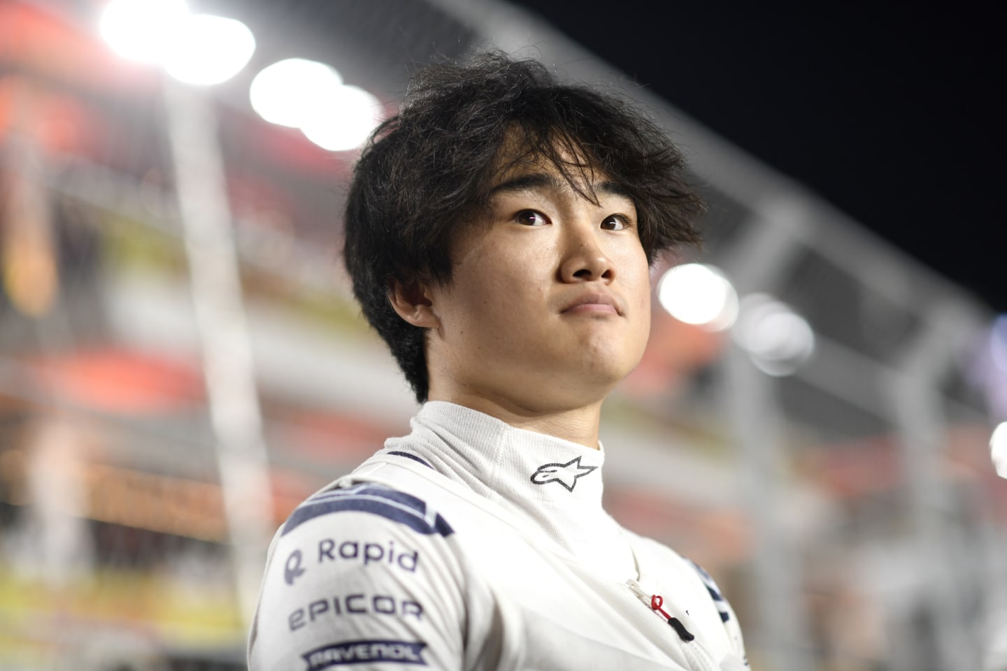 LUSAIL CITY, QATAR - OCTOBER 07: Yuki Tsunoda of Japan and Scuderia AlphaTauri looks on from the grid prior to the Sprint ahead of the F1 Grand Prix of Qatar at Lusail International Circuit on October 07, 2023 in Lusail City, Qatar. (Photo by Rudy Carezzevoli/Getty Images)