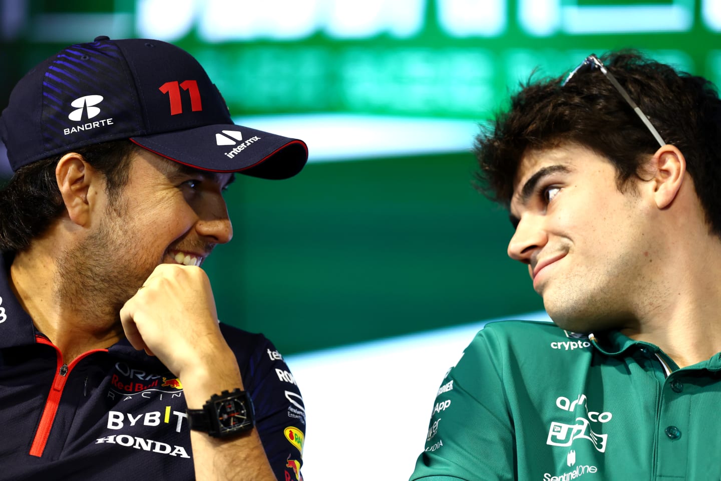 JEDDAH, SAUDI ARABIA - MARCH 16: Sergio Perez of Mexico and Oracle Red Bull Racing and Lance Stroll of Canada and Aston Martin F1 Team talk in the Drivers Press Conference during previews ahead of the F1 Grand Prix of Saudi Arabia at Jeddah Corniche Circuit on March 16, 2023 in Jeddah, Saudi Arabia. (Photo by Bryn Lennon/Getty Images)
