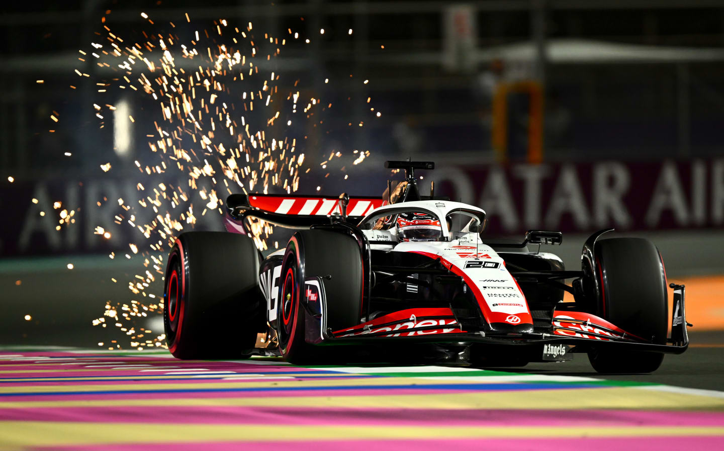 JEDDAH, SAUDI ARABIA - MARCH 18: Sparks fly behind Kevin Magnussen of Denmark driving the (20) Haas F1 VF-23 Ferrari during qualifying ahead of the F1 Grand Prix of Saudi Arabia at Jeddah Corniche Circuit on March 18, 2023 in Jeddah, Saudi Arabia. (Photo by Clive Mason/Getty Images)