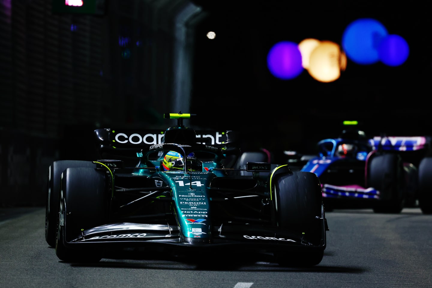 SINGAPORE, SINGAPORE - SEPTEMBER 17: Fernando Alonso of Spain driving the (14) Aston Martin AMR23