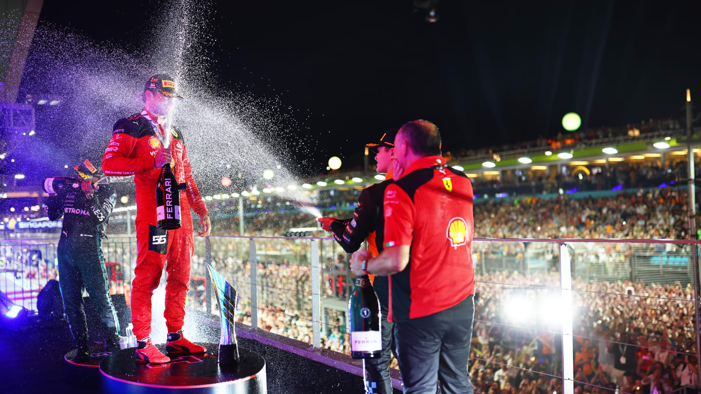 SINGAPORE, SINGAPORE - SEPTEMBER 17: Race winner Carlos Sainz of Spain and Ferrari celebrates with