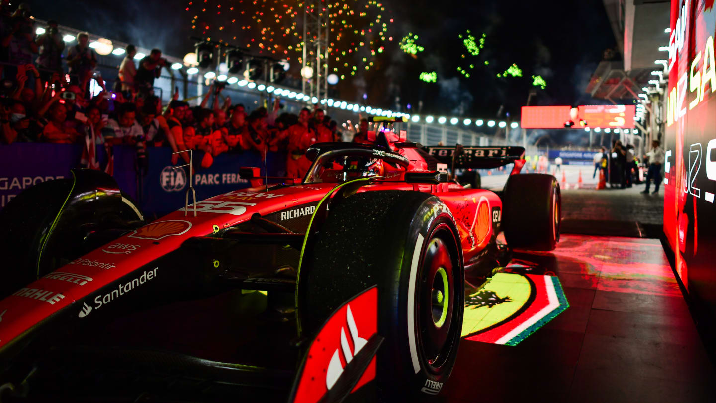 SINGAPORE, SINGAPORE - SEPTEMBER 17: Race winner Carlos Sainz of Spain and Ferrari arrives in parc ferme during the F1 Grand Prix of Singapore at Marina Bay Street Circuit on September 17, 2023 in Singapore, Singapore. (Photo by Mario Renzi - Formula 1/Formula 1 via Getty Images)