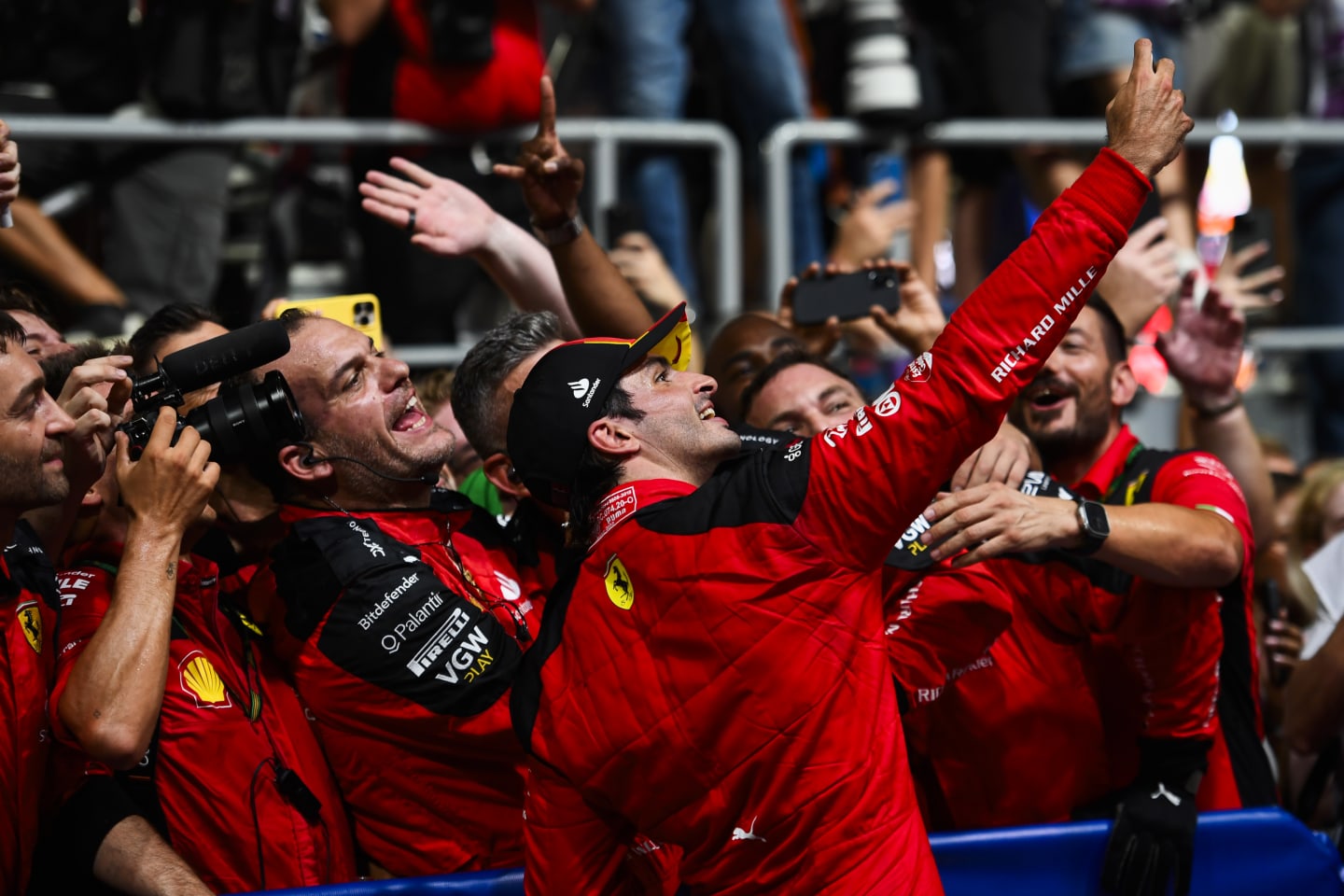 SINGAPORE, SINGAPORE - SEPTEMBER 17: Race winner Carlos Sainz of Spain and Ferrari celebrates with his team in parc ferme during the F1 Grand Prix of Singapore at Marina Bay Street Circuit on September 17, 2023 in Singapore, Singapore. (Photo by Rudy Carezzevoli/Getty Images)