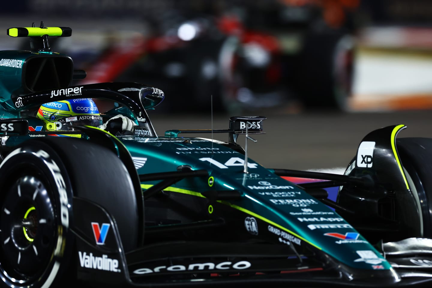 SINGAPORE, SINGAPORE - SEPTEMBER 17: Fernando Alonso of Spain driving the (14) Aston Martin AMR23