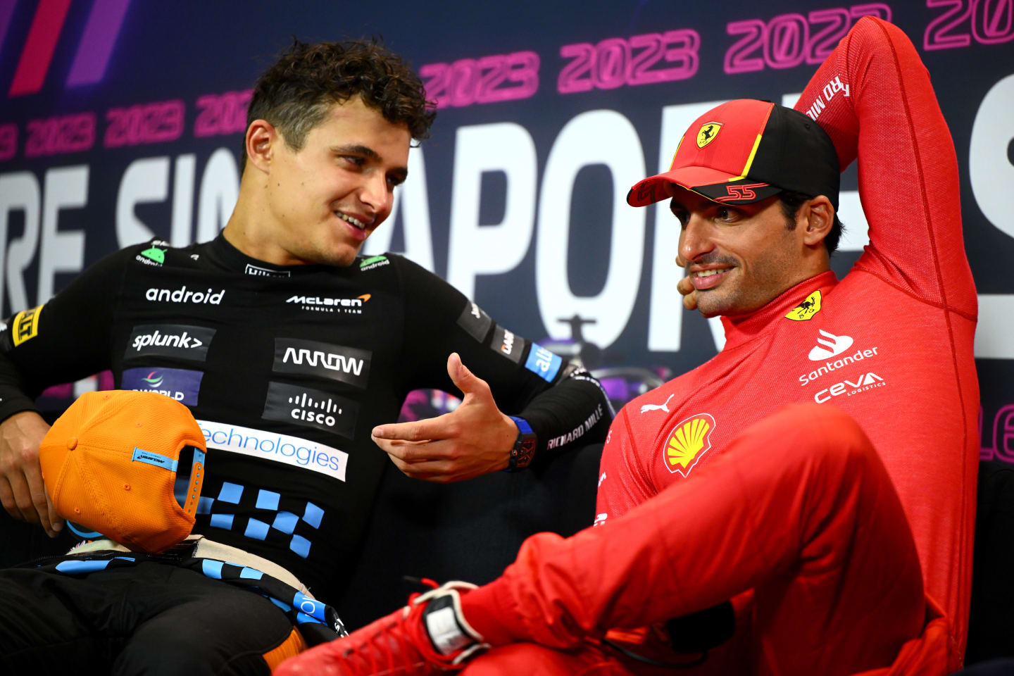 SINGAPORE, SINGAPORE - SEPTEMBER 17: Second placed Lando Norris of Great Britain and McLaren talks with race winner Carlos Sainz of Spain and Ferrari in a press conference after the F1 Grand Prix of Singapore at Marina Bay Street Circuit on September 17, 2023 in Singapore, Singapore. (Photo by Clive Mason/Getty Images)