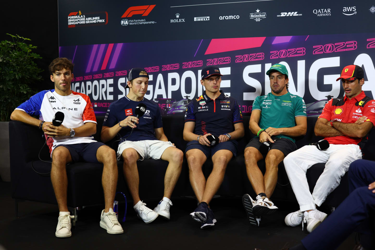 SINGAPORE, SINGAPORE - SEPTEMBER 14: Pierre Gasly of France and Alpine F1, Liam Lawson of New Zealand and Scuderia AlphaTauri, Max Verstappen of the Netherlands and Oracle Red Bull Racing, Fernando Alonso of Spain and Aston Martin F1 Team and Carlos Sainz of Spain and Ferrari  attend the Drivers Press Conference during previews ahead of the F1 Grand Prix of Singapore at Marina Bay Street Circuit on September 14, 2023 in Singapore, Singapore. (Photo by Clive Rose/Getty Images)