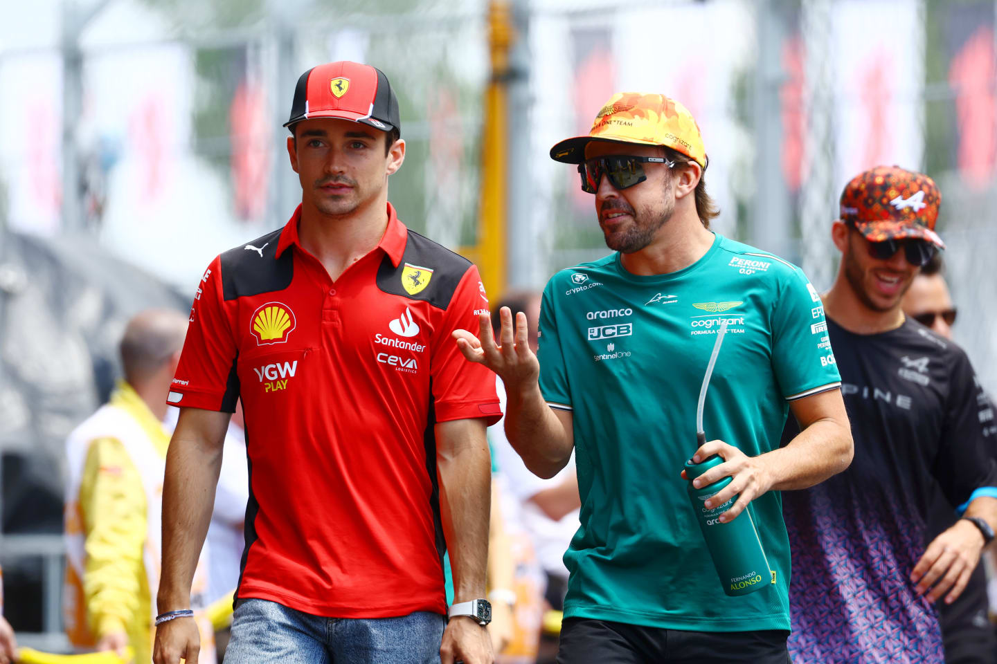 BARCELONA, SPAIN - JUNE 04: Charles Leclerc of Monaco and Ferrari talks with Fernando Alonso of